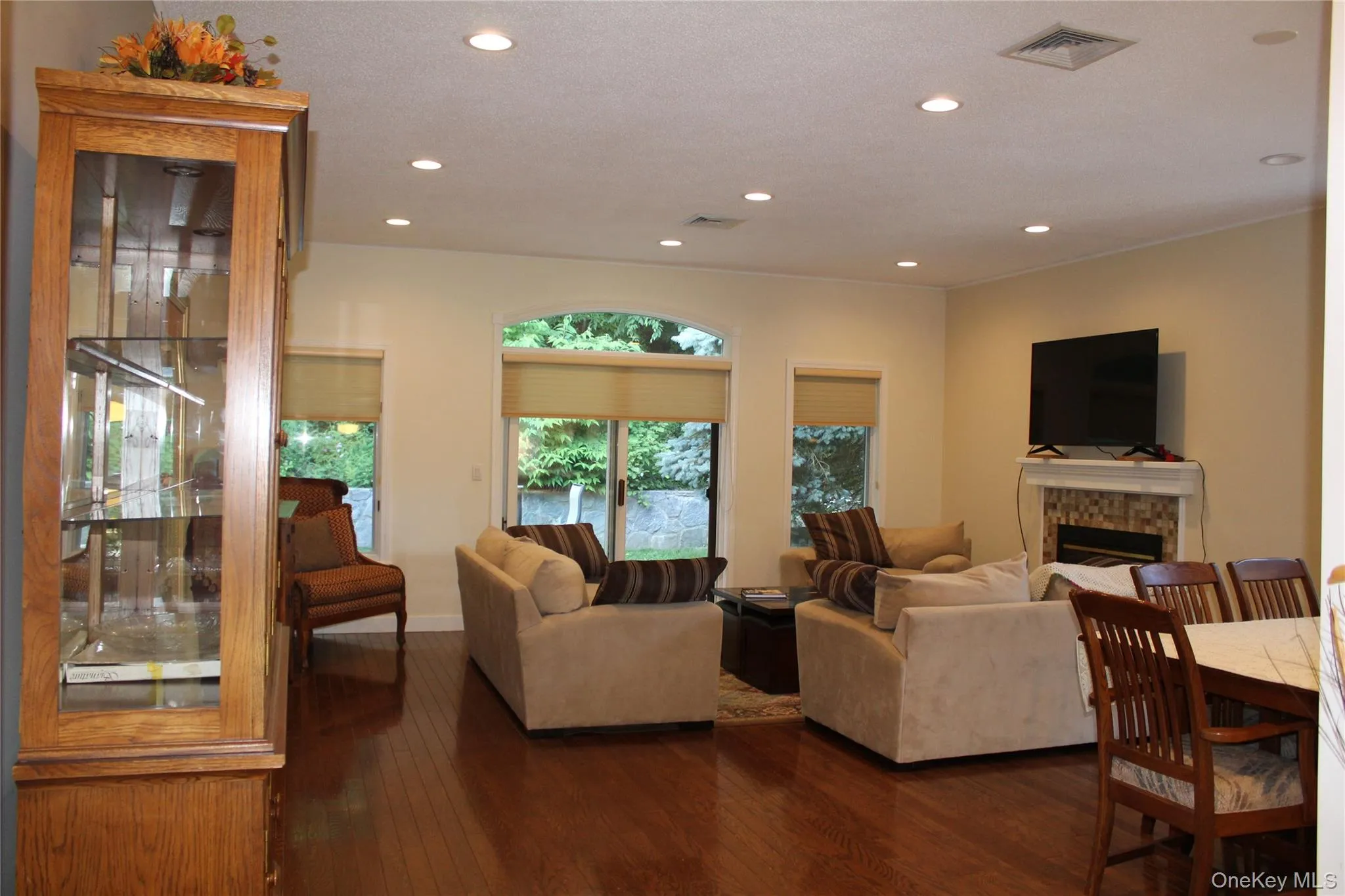 Living room with fireplace and shared dining area Living room with fireplace and shared dining area