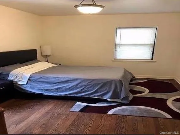 Bedroom with wood finished floors Bedroom with wood finished floors