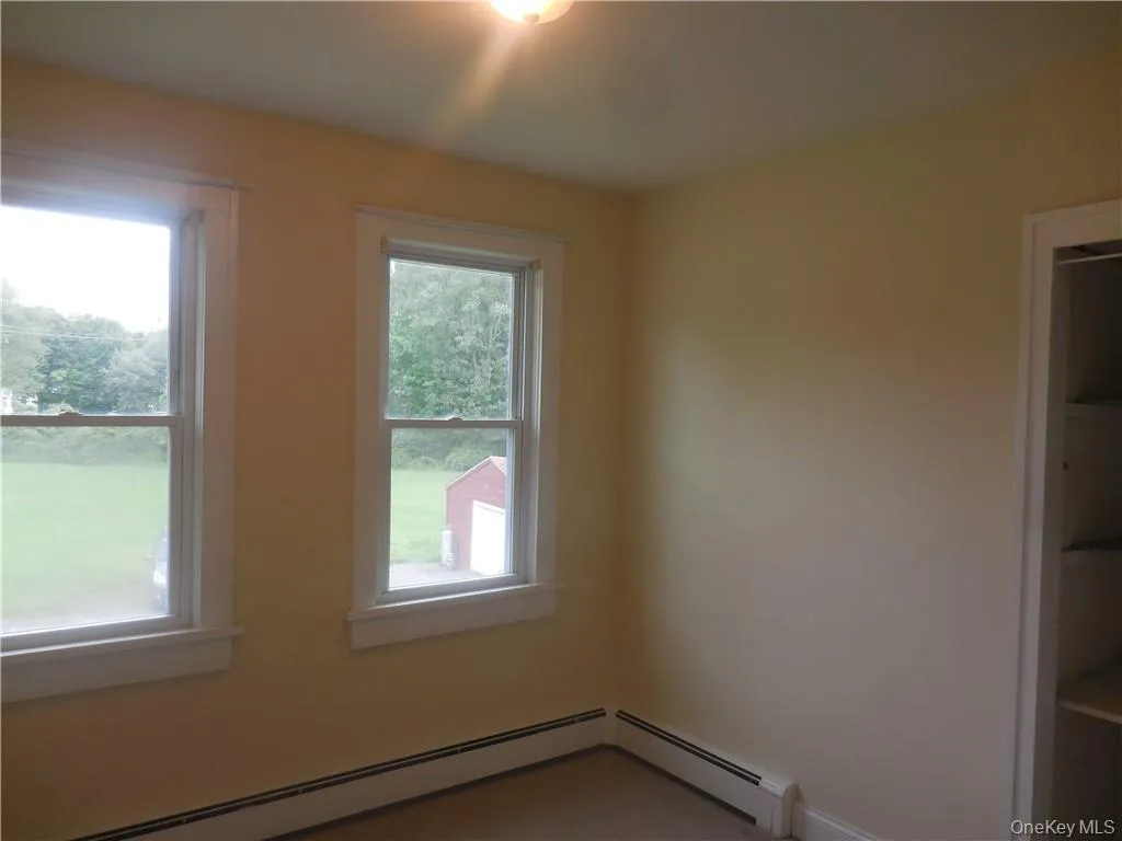 Spare room featuring baseboard heating Spare room featuring baseboard heating