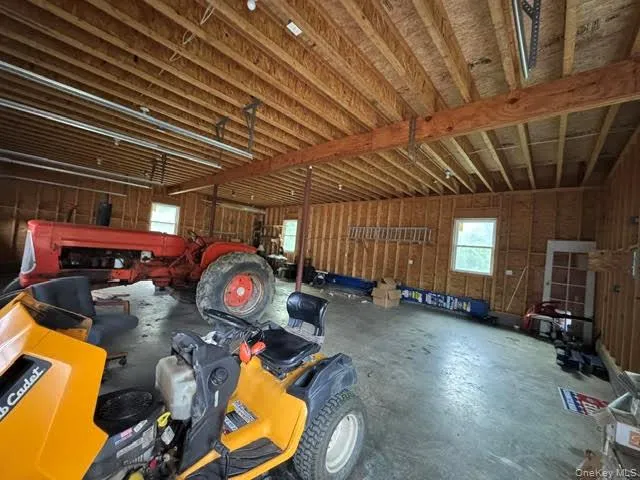 View of the large garage interior. View of the large garage interior.