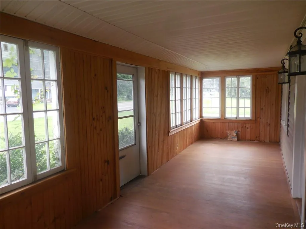 Unfurnished sunroom with a wealth of natural light Unfurnished sunroom with a wealth of natural light