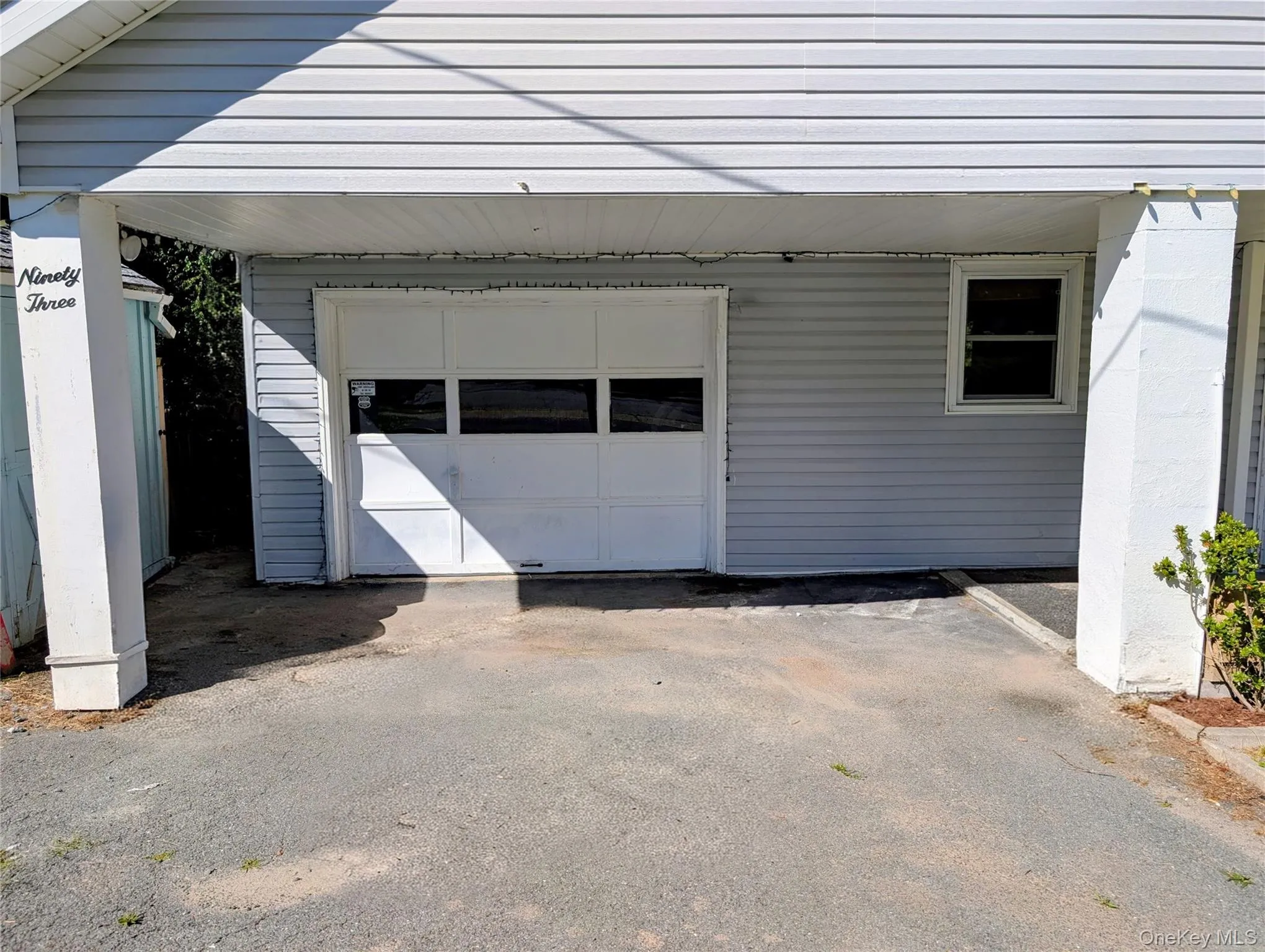 paved driveway and garage paved driveway and garage