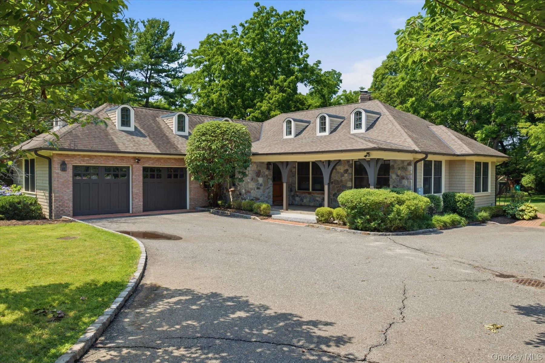 Belgian block accents, cedar shingles, and Pennsylvania river rock create lasting curb appeal Belgian block accents, cedar shingles, and Pennsylvania river rock create lasting curb appeal