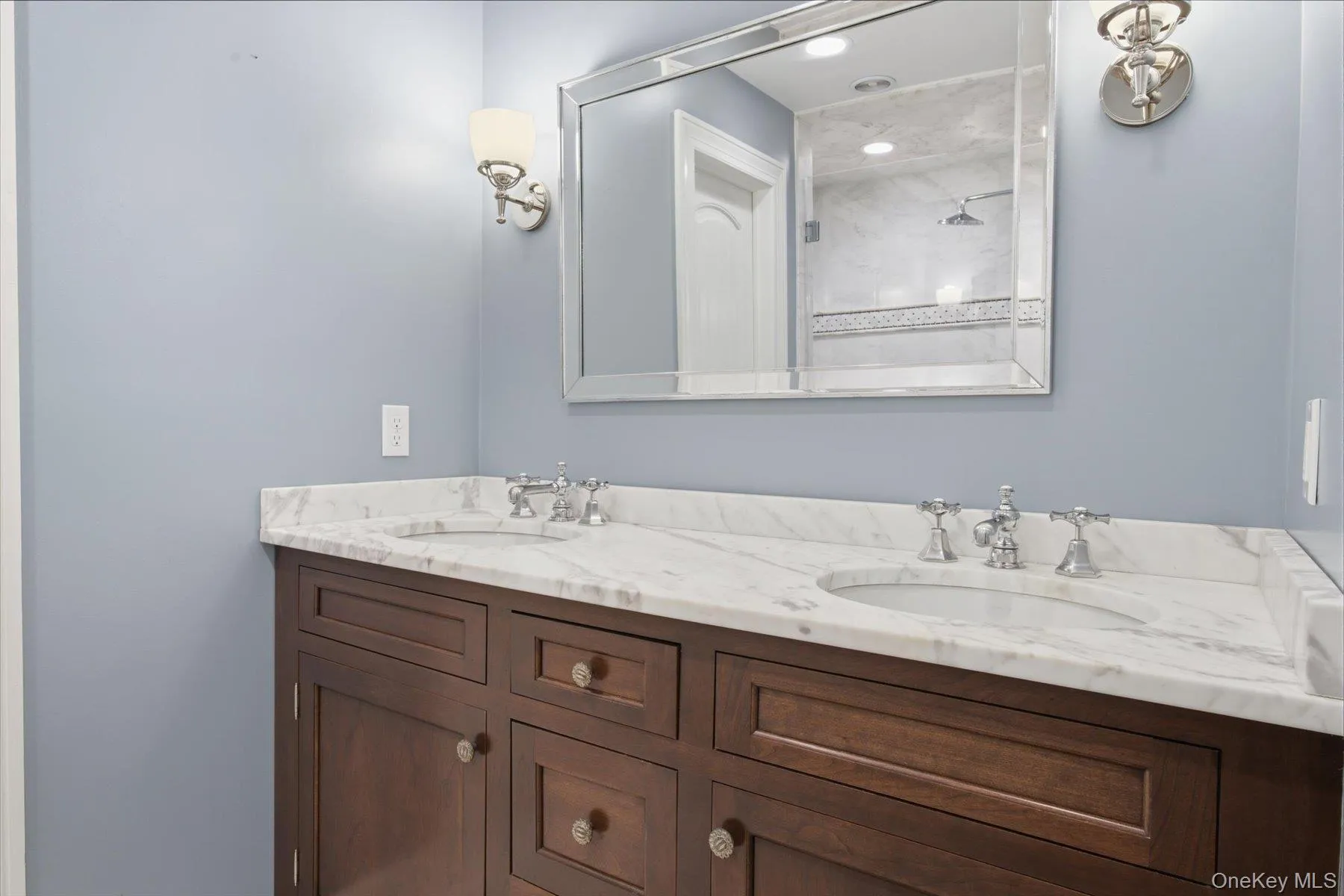 Carrara marble finishes and timeless custom cabinetry. Carrara marble finishes and timeless custom cabinetry.