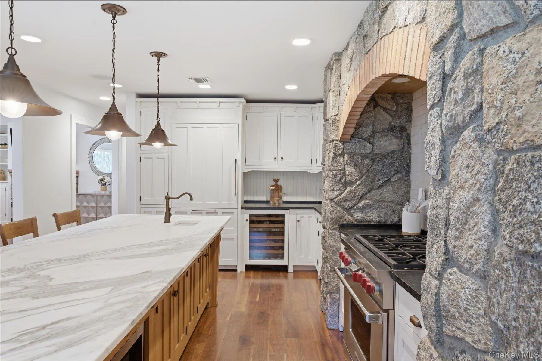 Oversized Calcutta marble island with prep sink great for entertaining Oversized Calcutta marble island with prep sink great for entertaining