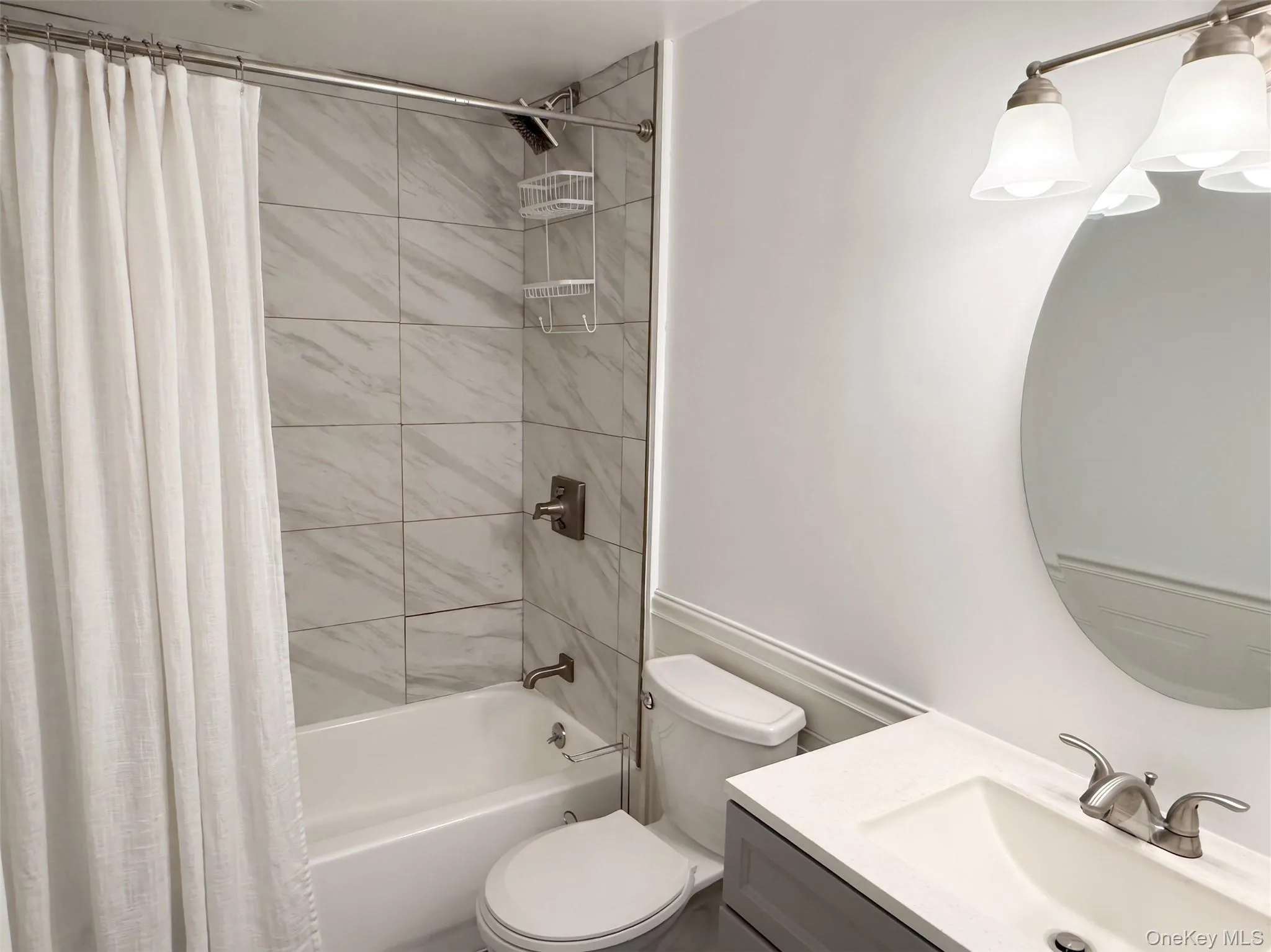 Full bathroom with tub and vanity. Full bathroom with tub and vanity.