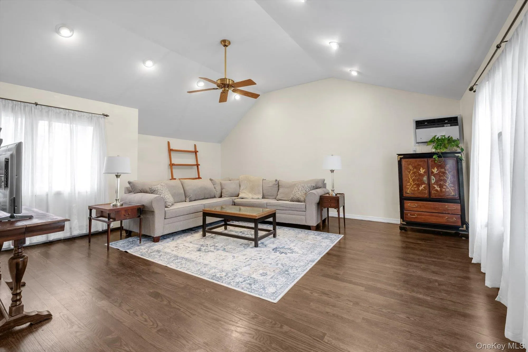 Vaulted ceiling featuring recessed lighting and a ceiling fan Vaulted ceiling featuring recessed lighting and a ceiling fan