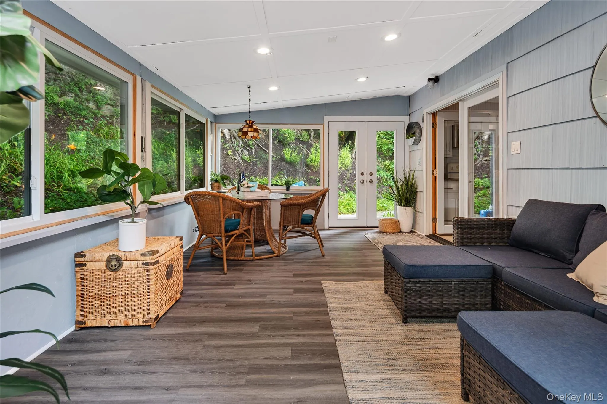 Step into this charming home through a pair of glass doors that open into the wonderful three-season room. Step into this charming home through a pair of glass doors that open into the wonderful three-season room.