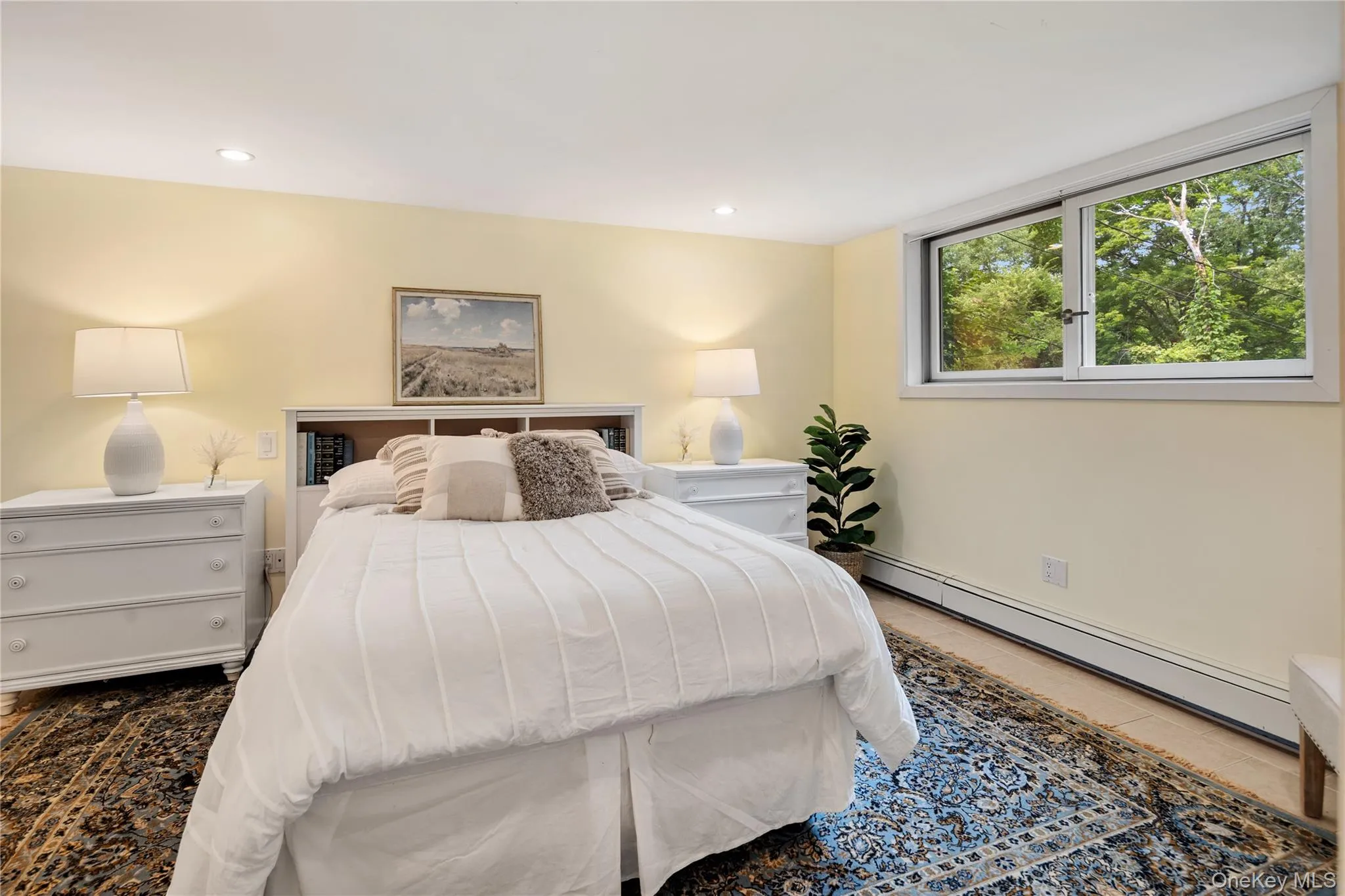 Windows in the lower level bedroom provide natural light. Windows in the lower level bedroom provide natural light.