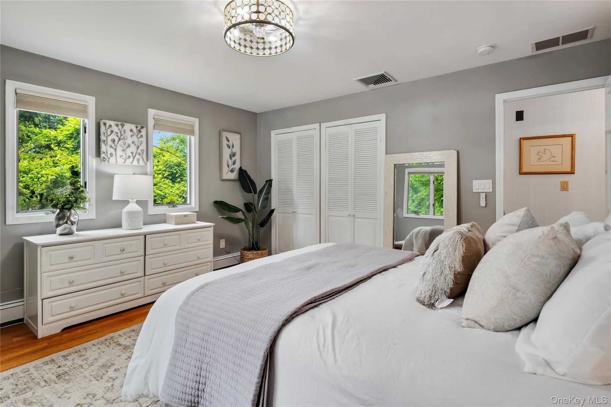 Double closets and novelty fandolier are additional highlights to the primary bedroom. Double closets and novelty fandolier are additional highlights to the primary bedroom.