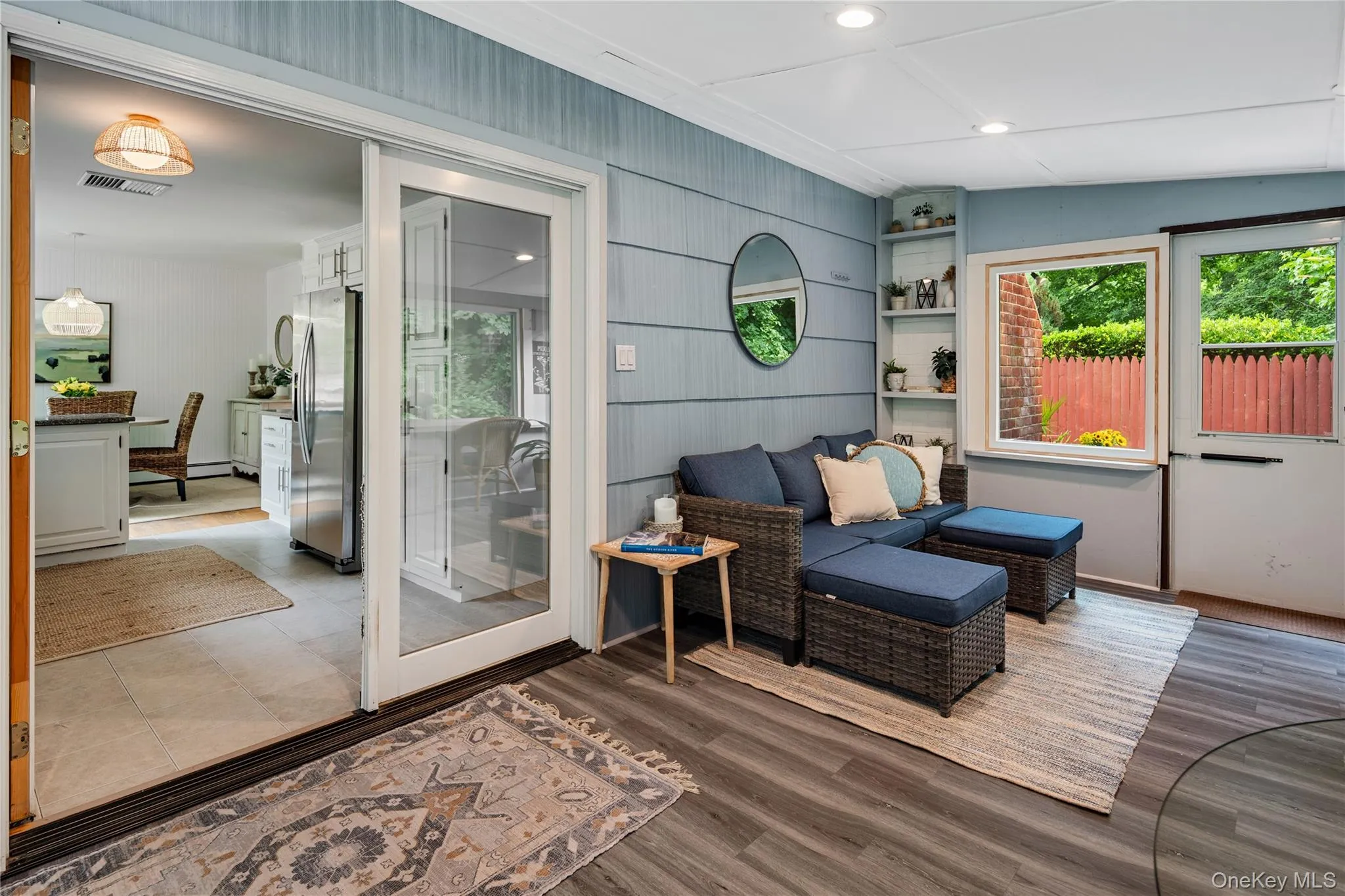 The French doors open into the main home, filling the space with sunlight and beautiful natural views. The French doors open into the main home, filling the space with sunlight and beautiful natural views.