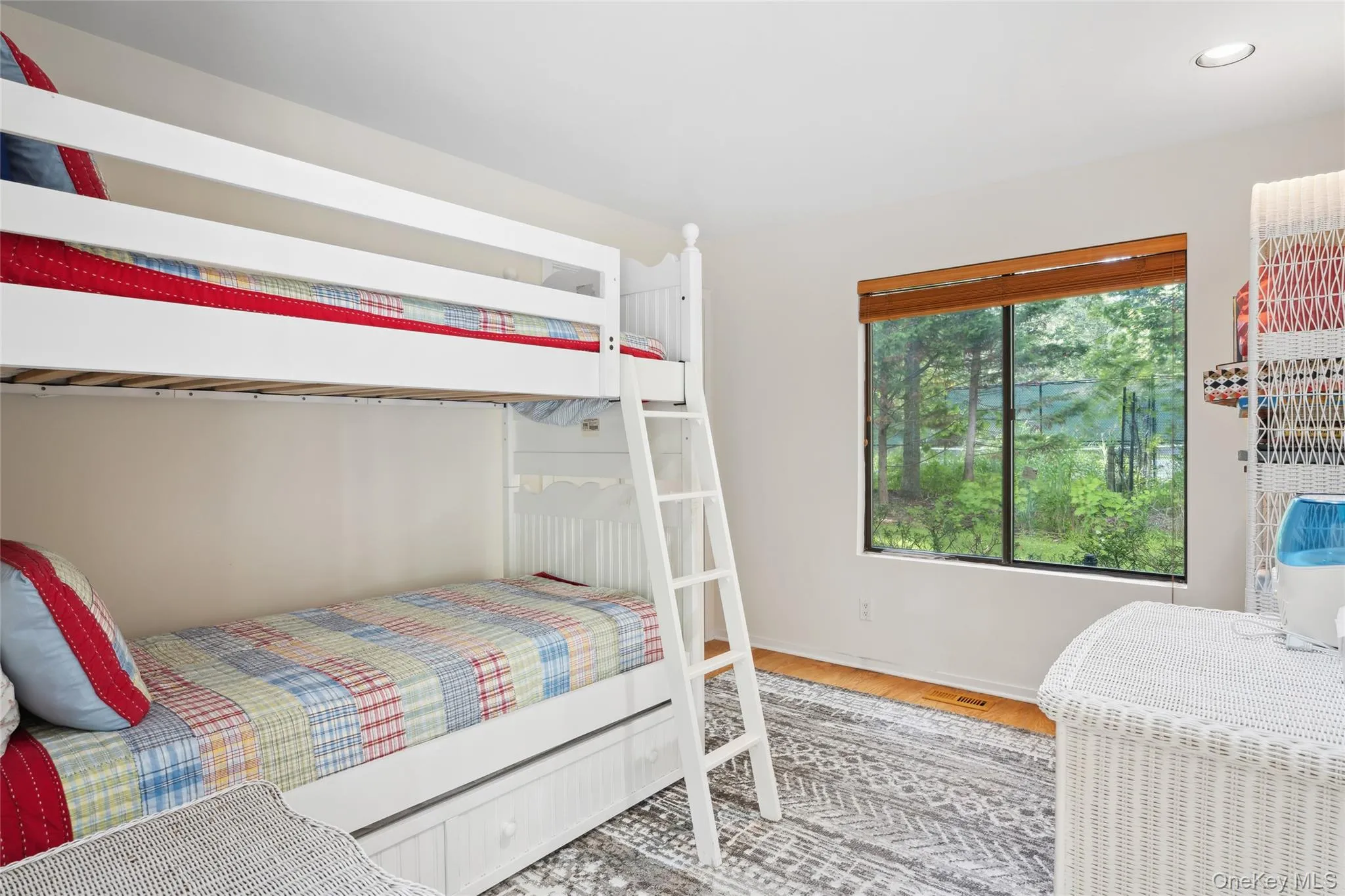 Bedroom featuring wood finished floors Bedroom featuring wood finished floors