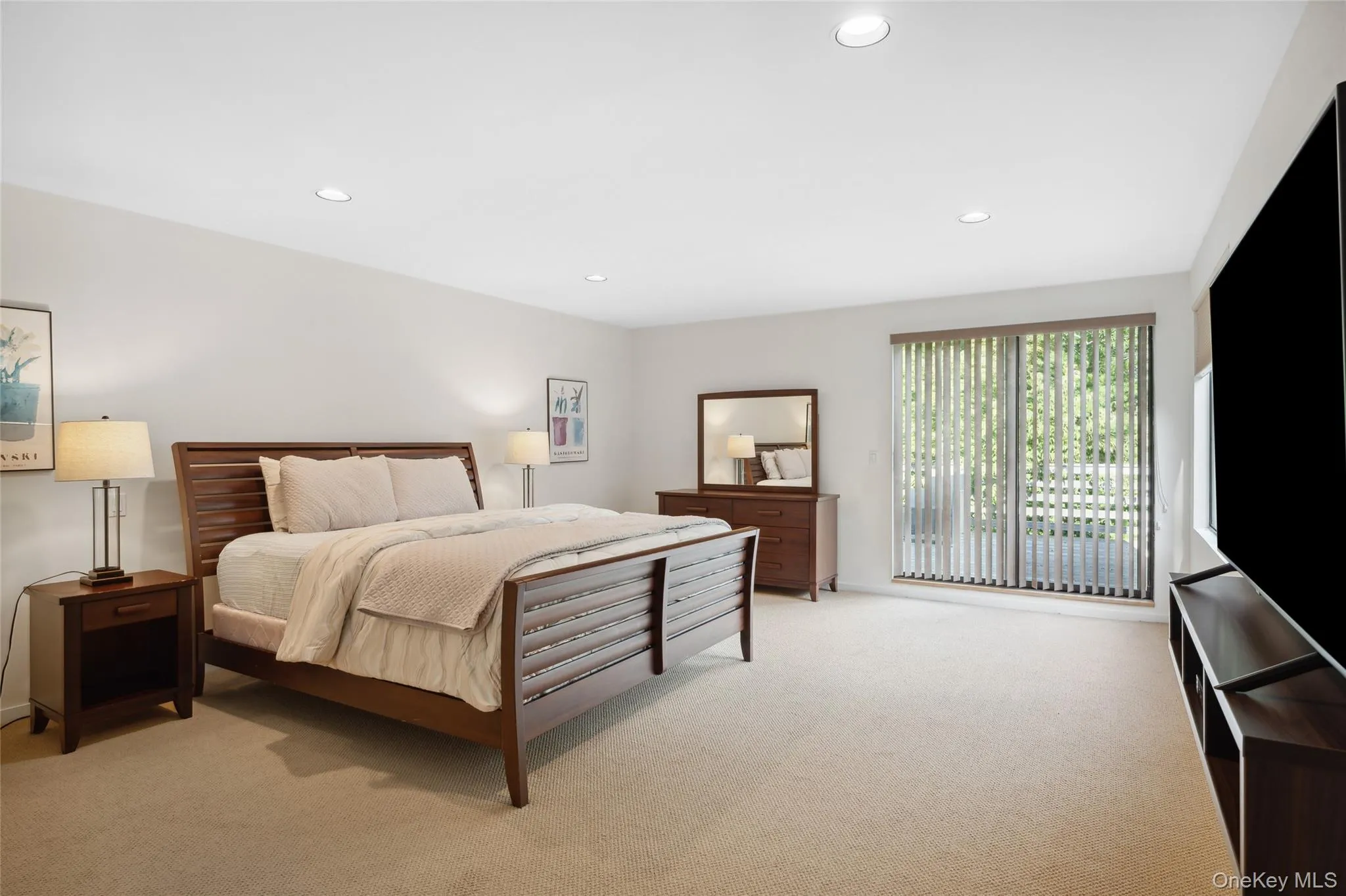 Bedroom featuring recessed lighting and light colored carpet Bedroom featuring recessed lighting and light colored carpet