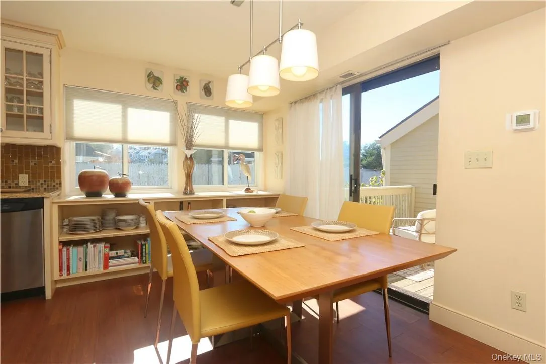 Dining area with sliding door to private deck Dining area with sliding door to private deck