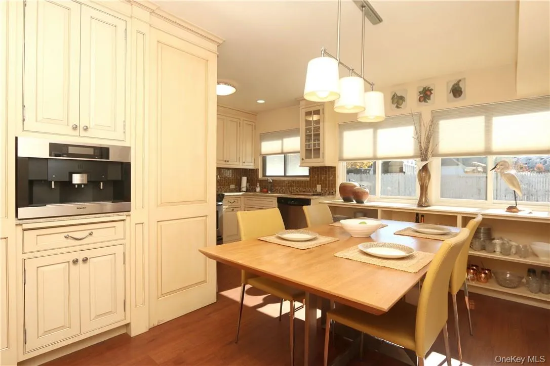 The kitchen offers an abundance of cabinetry and built-in shelves under the window The kitchen offers an abundance of cabinetry and built-in shelves under the window