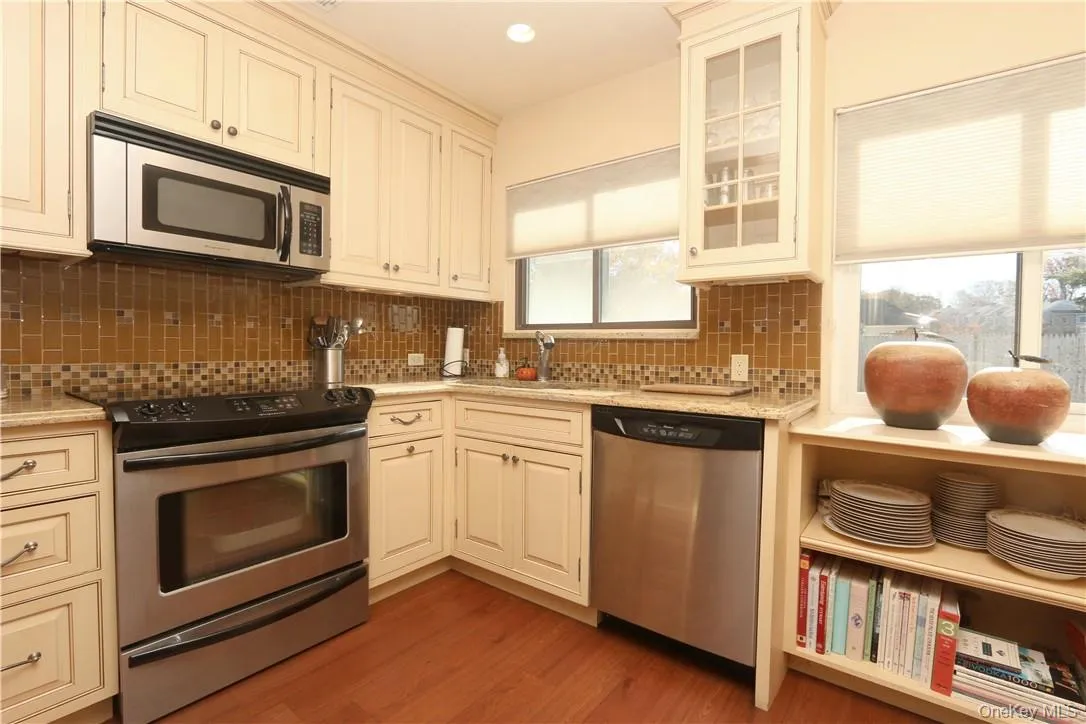 Kitchen with granite counters and stainless steel appliances Kitchen with granite counters and stainless steel appliances
