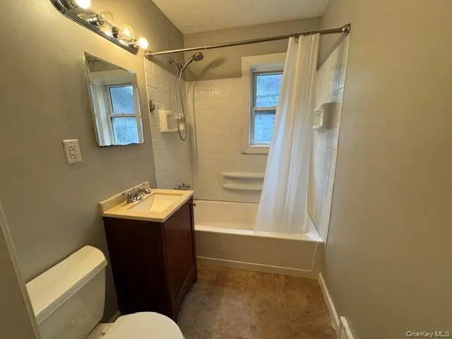 With a tub. With a tub.