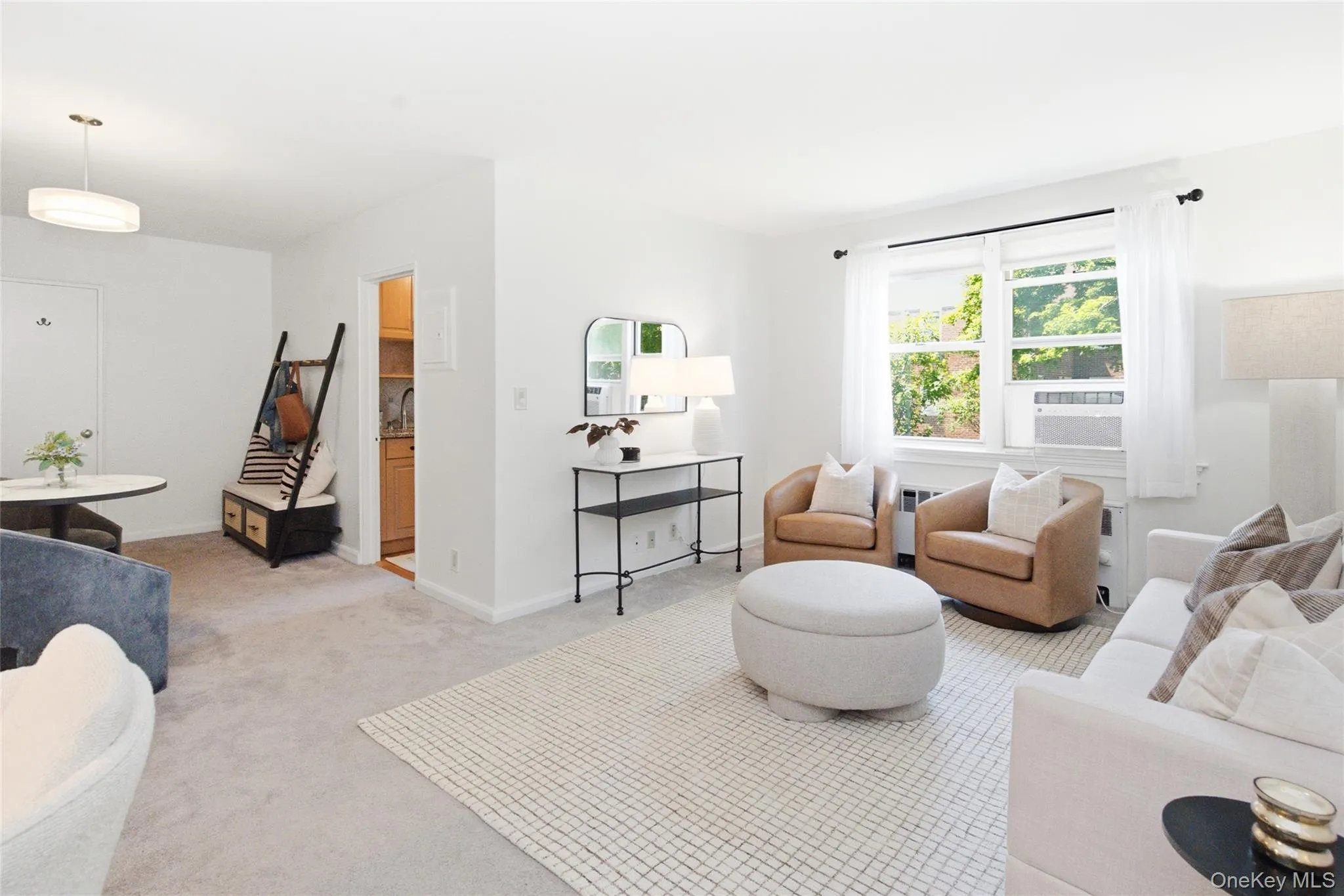 Spacious living room highlighting the room's scale, natural light, and classic Tudor charm. Spacious living room highlighting the room's scale, natural light, and classic Tudor charm.