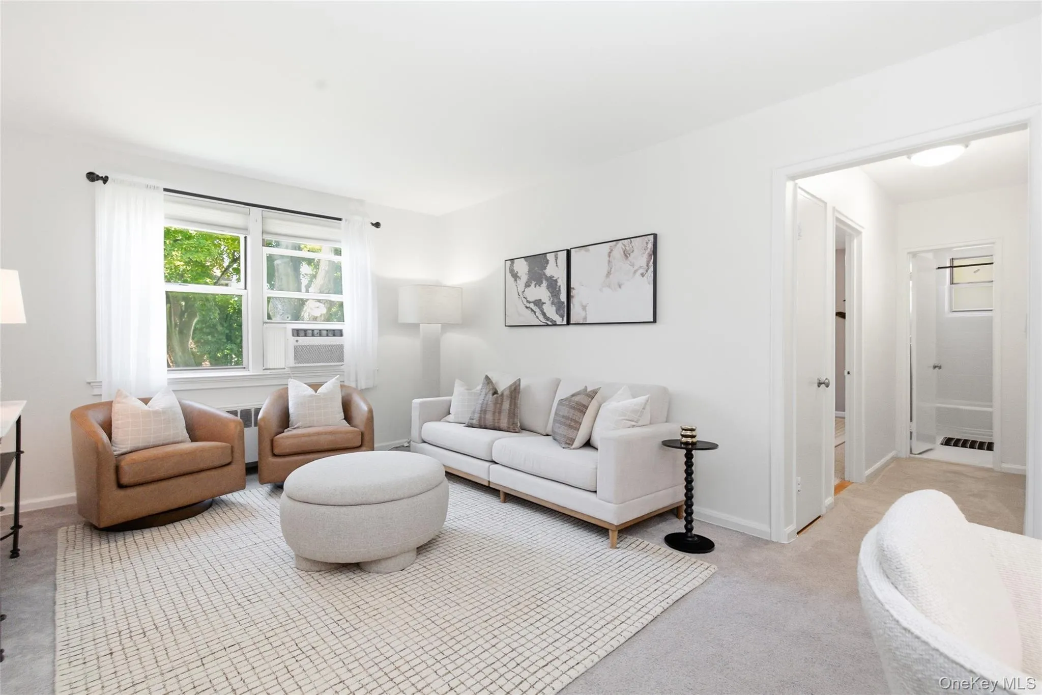 Alternate view of the inviting living room, illustrating how the space can be beautifully furnished while preserving its timeless character. Alternate view of the inviting living room, illustrating how the space can be beautifully furnished while preserving its timeless character.