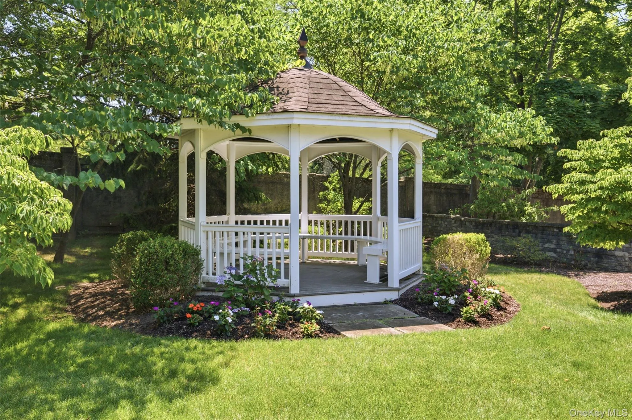 Residents enjoy a picturesque gazebo surrounded by professionally landscaped grounds—perfect for relaxing outdoors. Residents enjoy a picturesque gazebo surrounded by professionally landscaped grounds—perfect for relaxing outdoors.