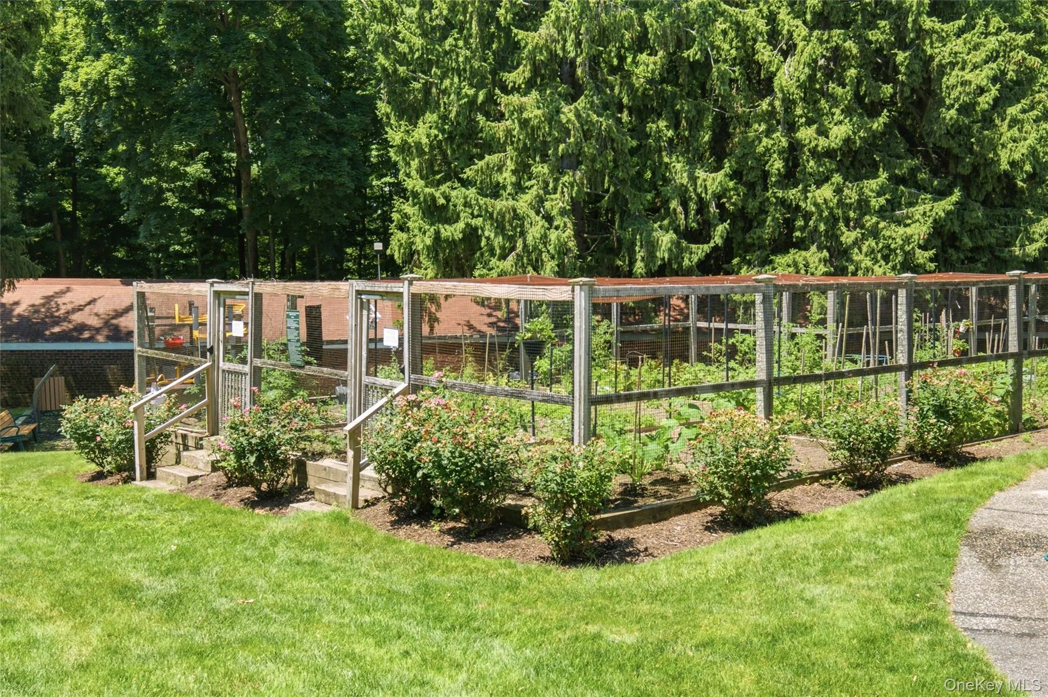 Beautifully maintained community garden provides a peaceful setting to enjoy nature and seasonal blooms. Beautifully maintained community garden provides a peaceful setting to enjoy nature and seasonal blooms.