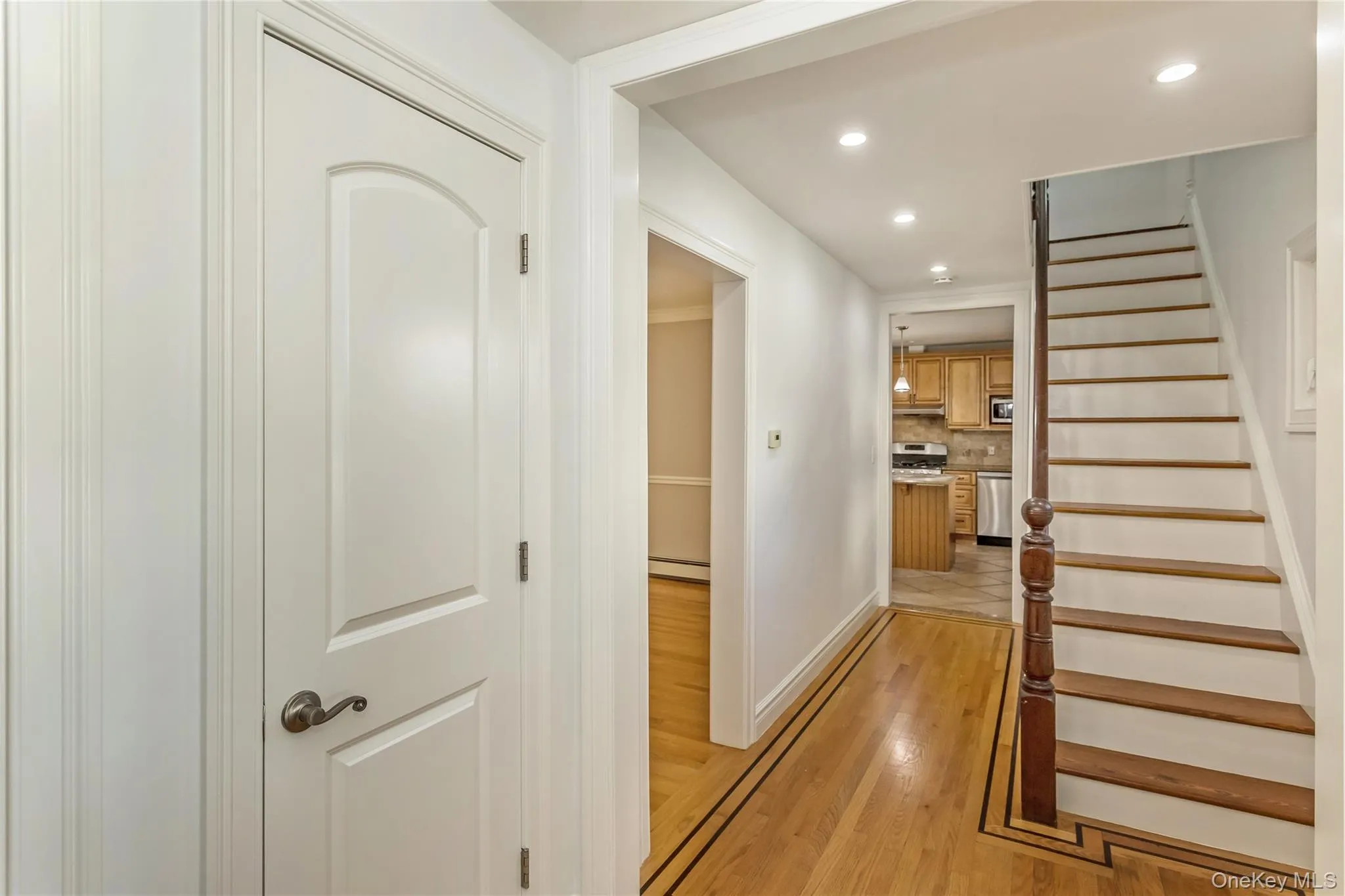 Staircase with recessed lighting and wood finished floors Staircase with recessed lighting and wood finished floors