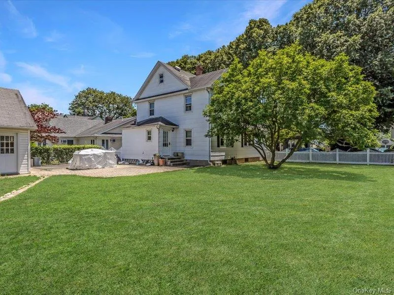 Back of property featuring entry steps and a patio Back of property featuring entry steps and a patio