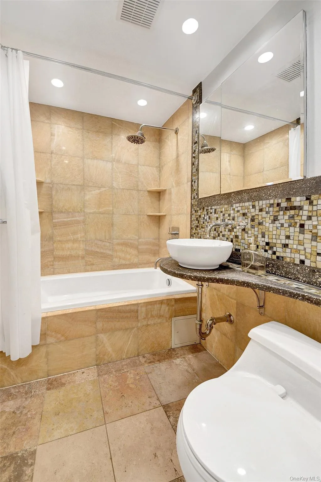 Updated bathroom with a deep soaking tub and modern fixtures Updated bathroom with a deep soaking tub and modern fixtures