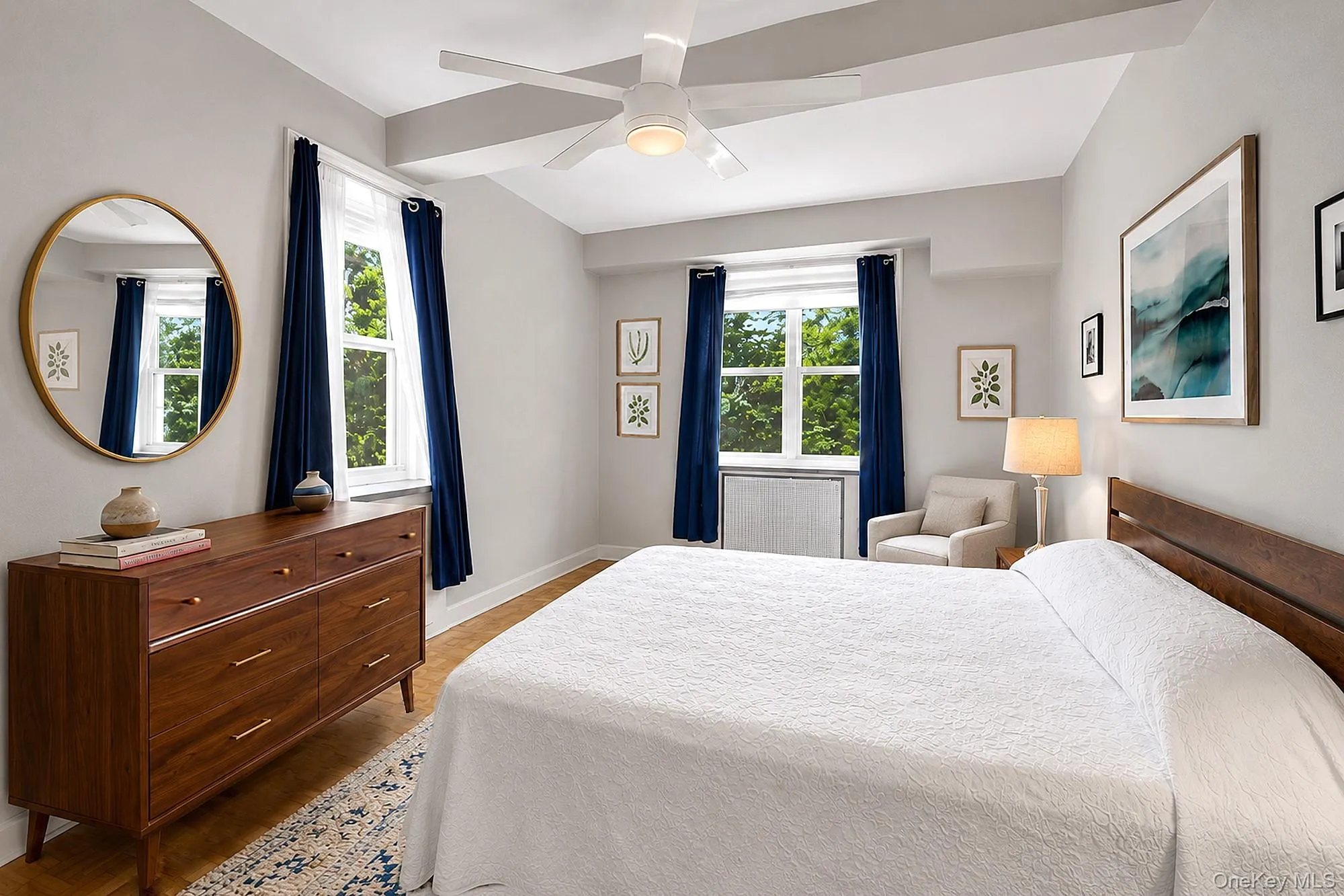 Large bedroom with tall beamed ceilings, double exposures, hardwood floors and two closets Large bedroom with tall beamed ceilings, double exposures, hardwood floors and two closets