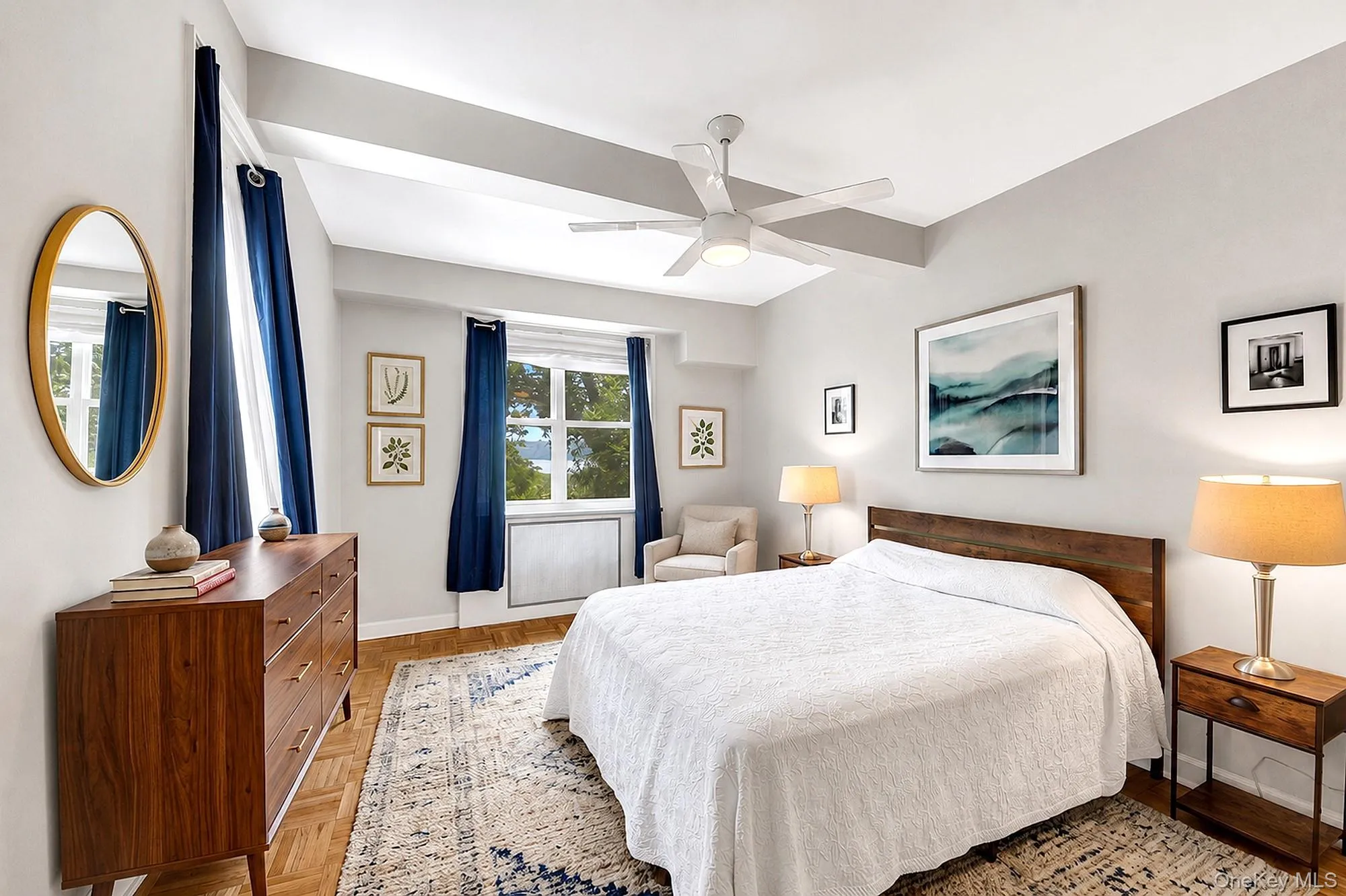 Large bedroom with tall beamed ceilings, double exposures, hardwood floors and two closets Large bedroom with tall beamed ceilings, double exposures, hardwood floors and two closets