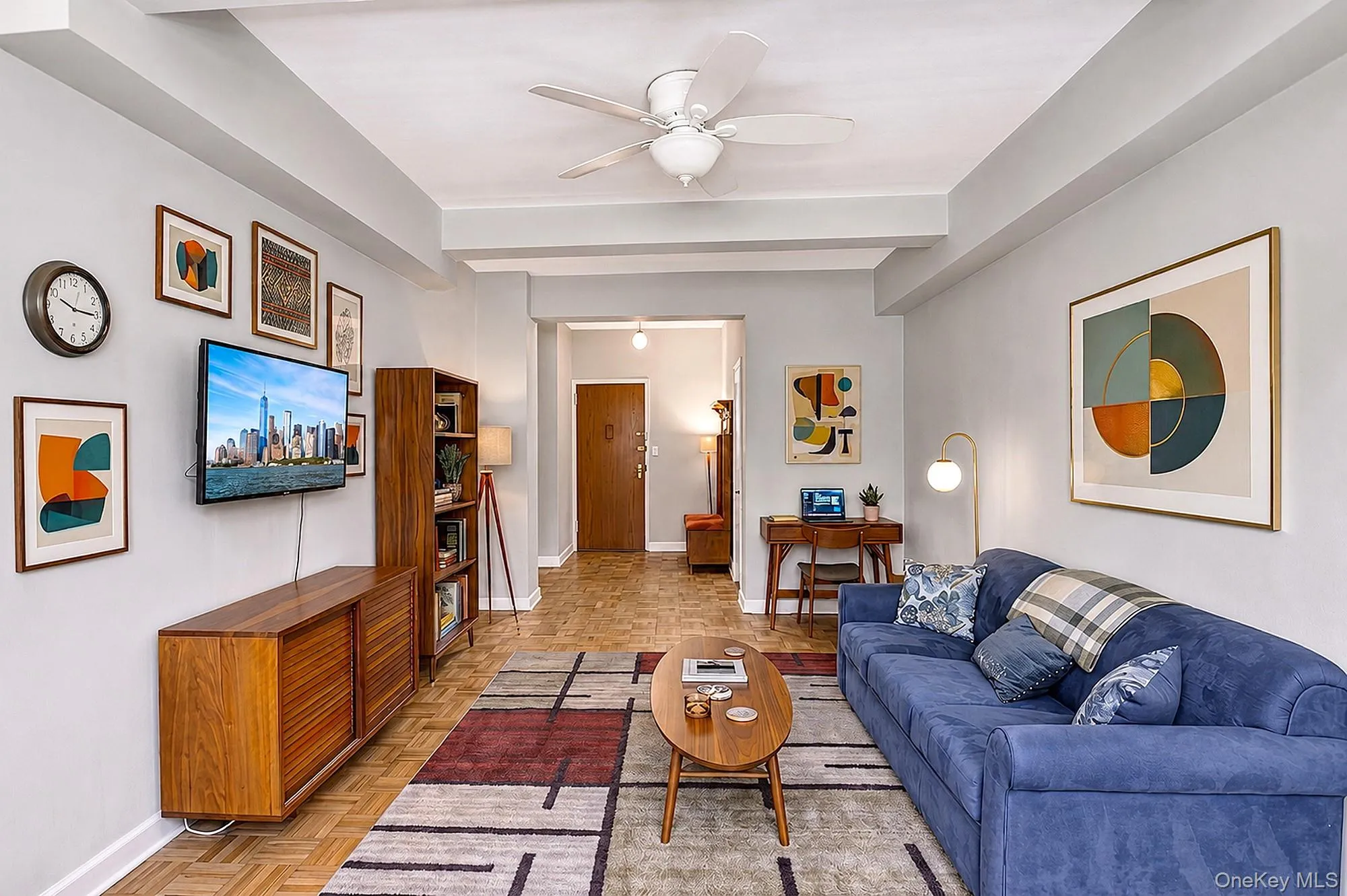Large and spacious living room with hardwood floors, tall beamed ceilings Large and spacious living room with hardwood floors, tall beamed ceilings