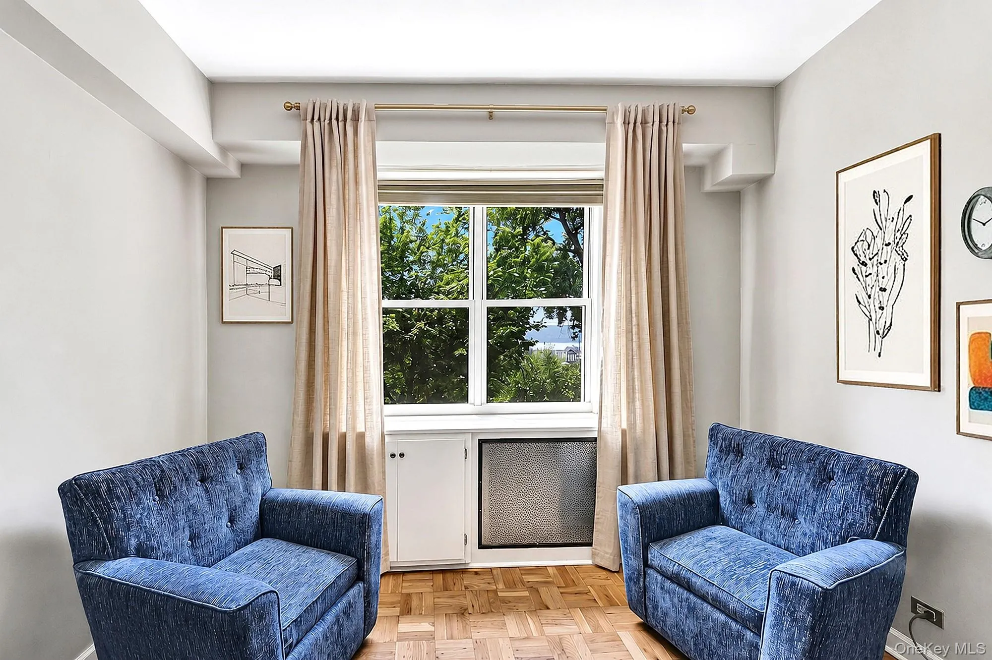 Large and spacious living room with hardwood floors, tall beamed ceilings and large windows with south-western exposure Large and spacious living room with hardwood floors, tall beamed ceilings and large windows with south-western exposure