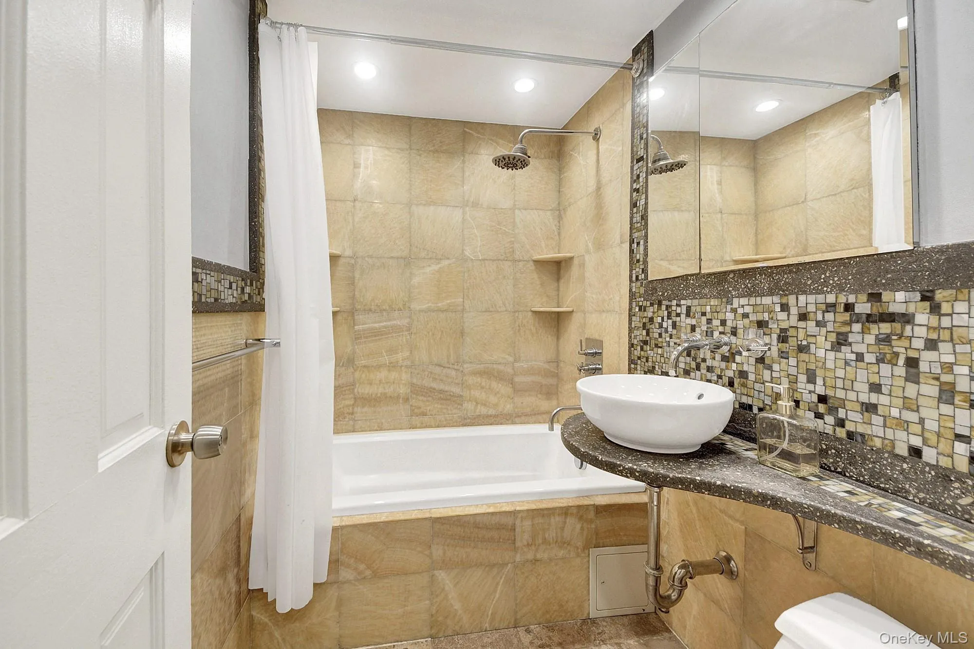 Updated bathroom with a deep soaking tub and modern fixtures Updated bathroom with a deep soaking tub and modern fixtures