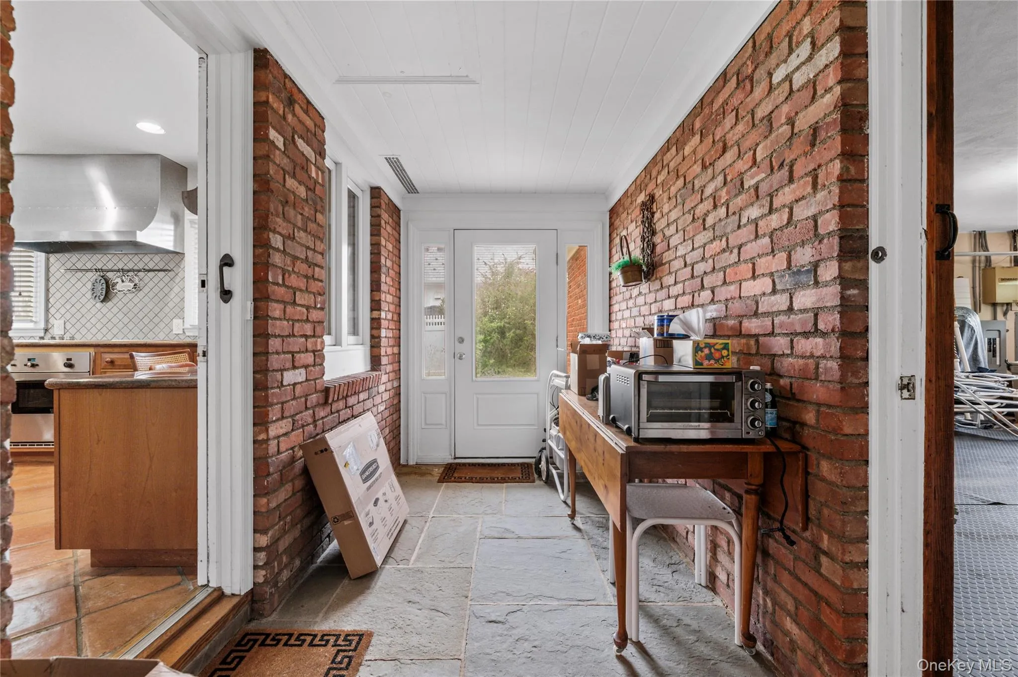 Covered vestibule from house to garage. Covered vestibule from house to garage.