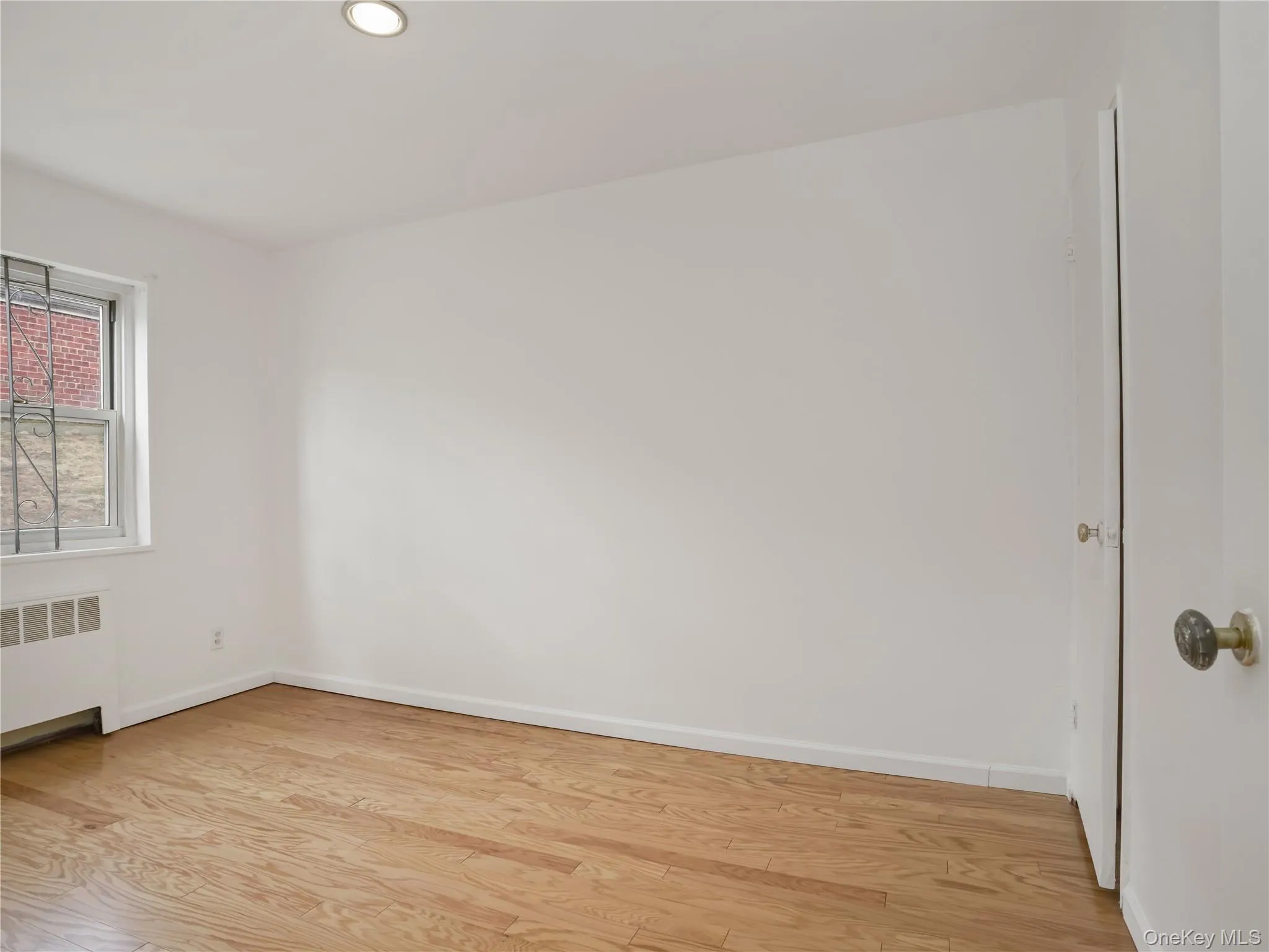 Bedroom with great natural light, freshly painted walls and wood floors. Bedroom with great natural light, freshly painted walls and wood floors.
