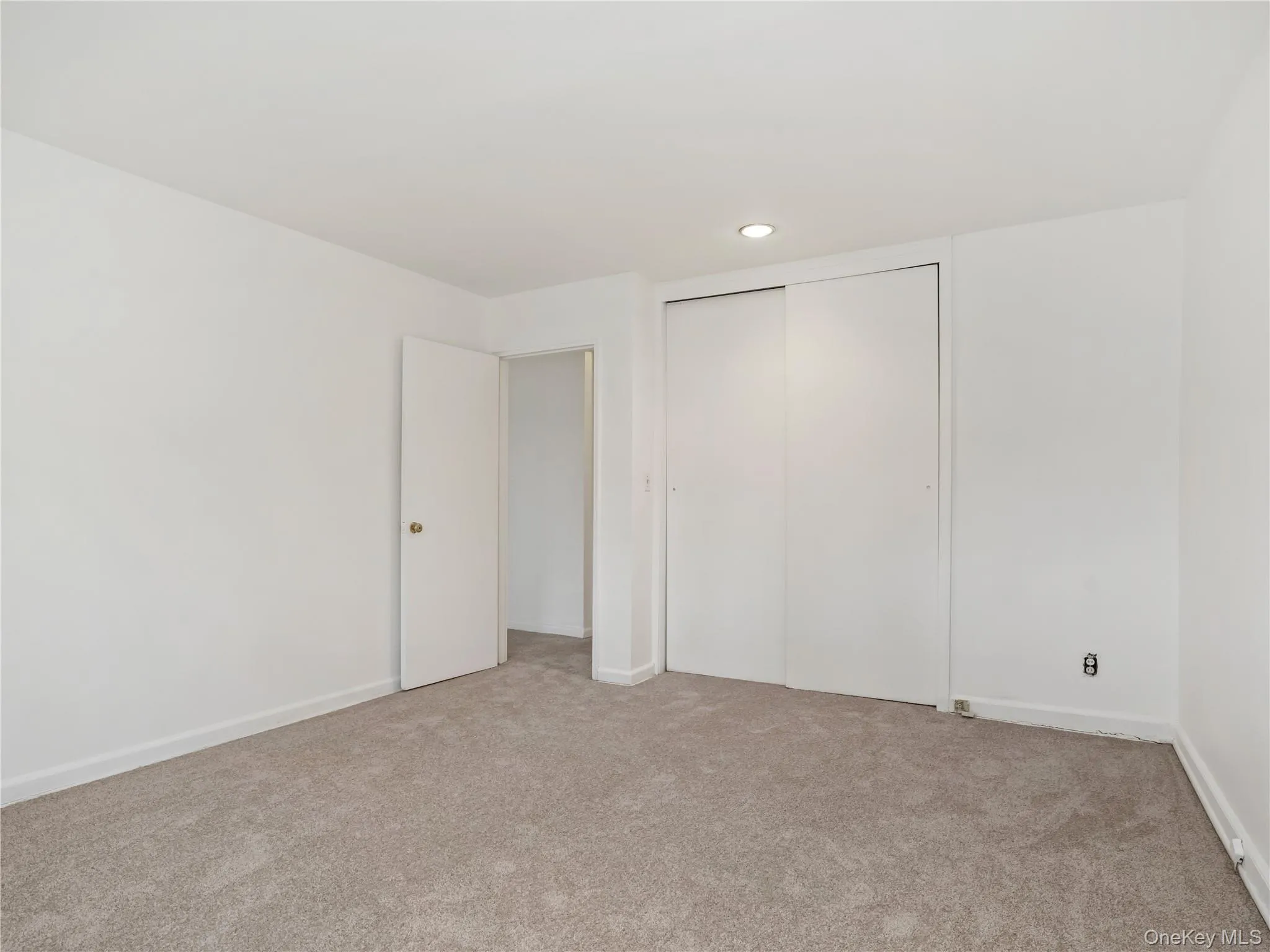 Primary Bedroom with great natural light, freshly painted walls and brand new carpet Primary Bedroom with great natural light, freshly painted walls and brand new carpet