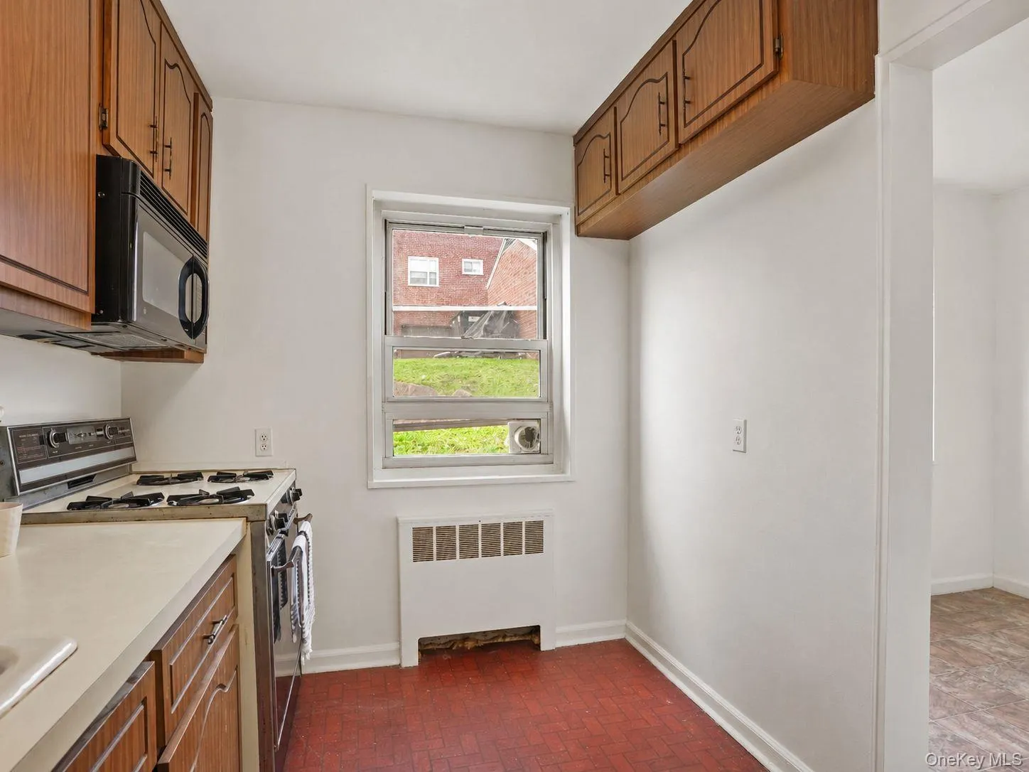 Kitchen featuring plenty of cabinet space, refrigerator, oven and microwave. Kitchen featuring plenty of cabinet space, refrigerator, oven and microwave.
