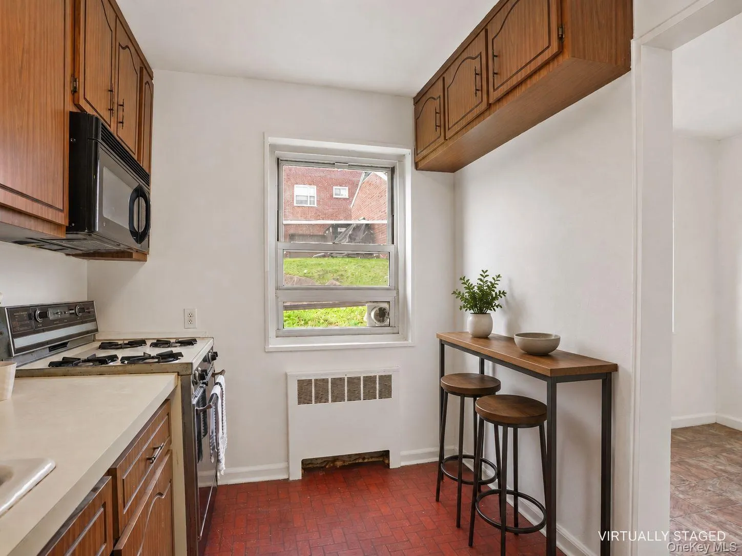 Kitchen featuring plenty of cabinet space, refrigerator, oven and microwave. Kitchen featuring plenty of cabinet space, refrigerator, oven and microwave.
