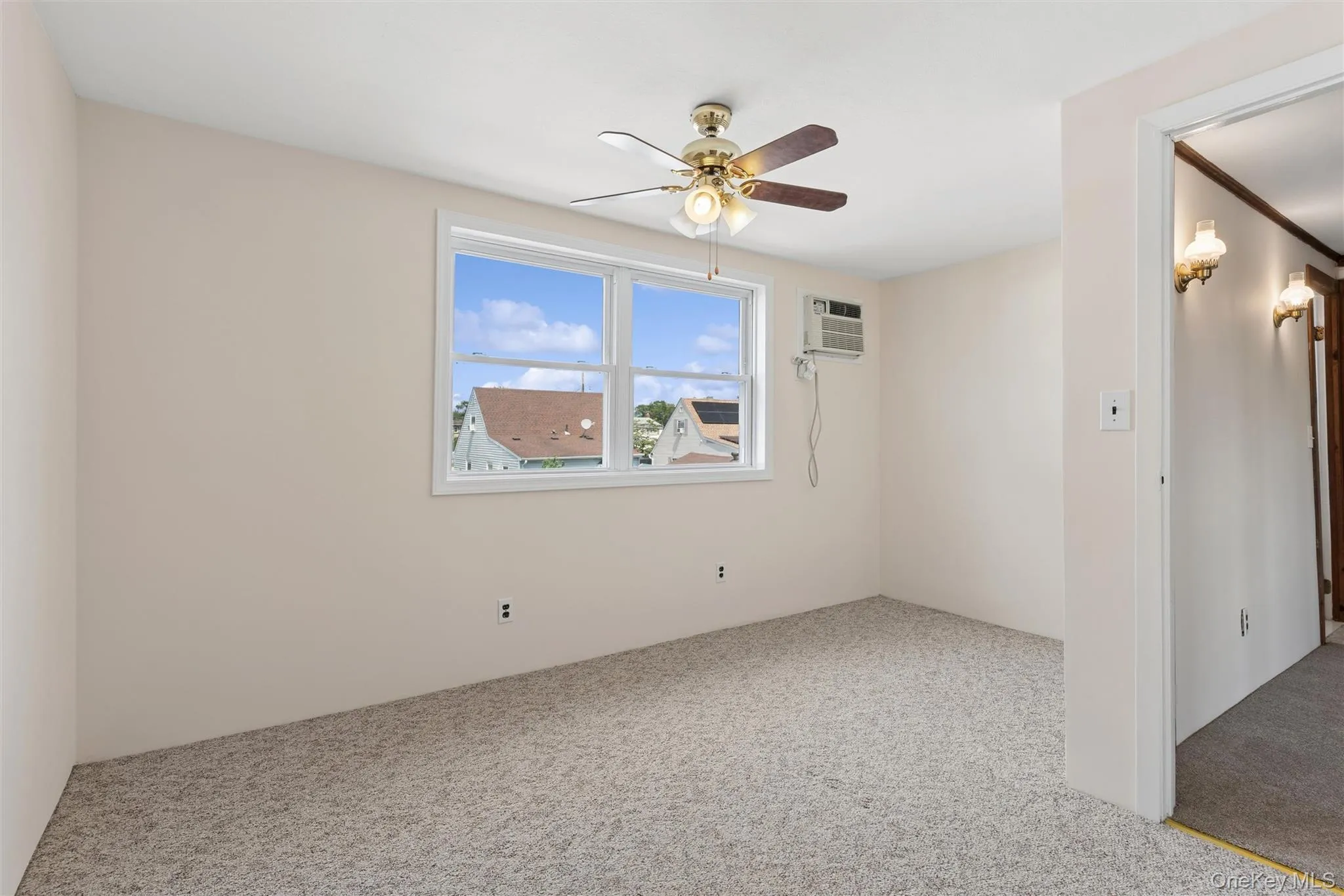 Bedroom with ceiling fan and carpet and plenty of natural light Bedroom with ceiling fan and carpet and plenty of natural light