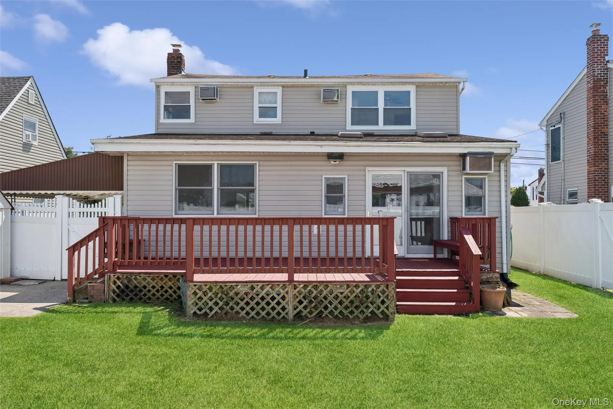 Fully-fenced yard and large back deck Fully-fenced yard and large back deck