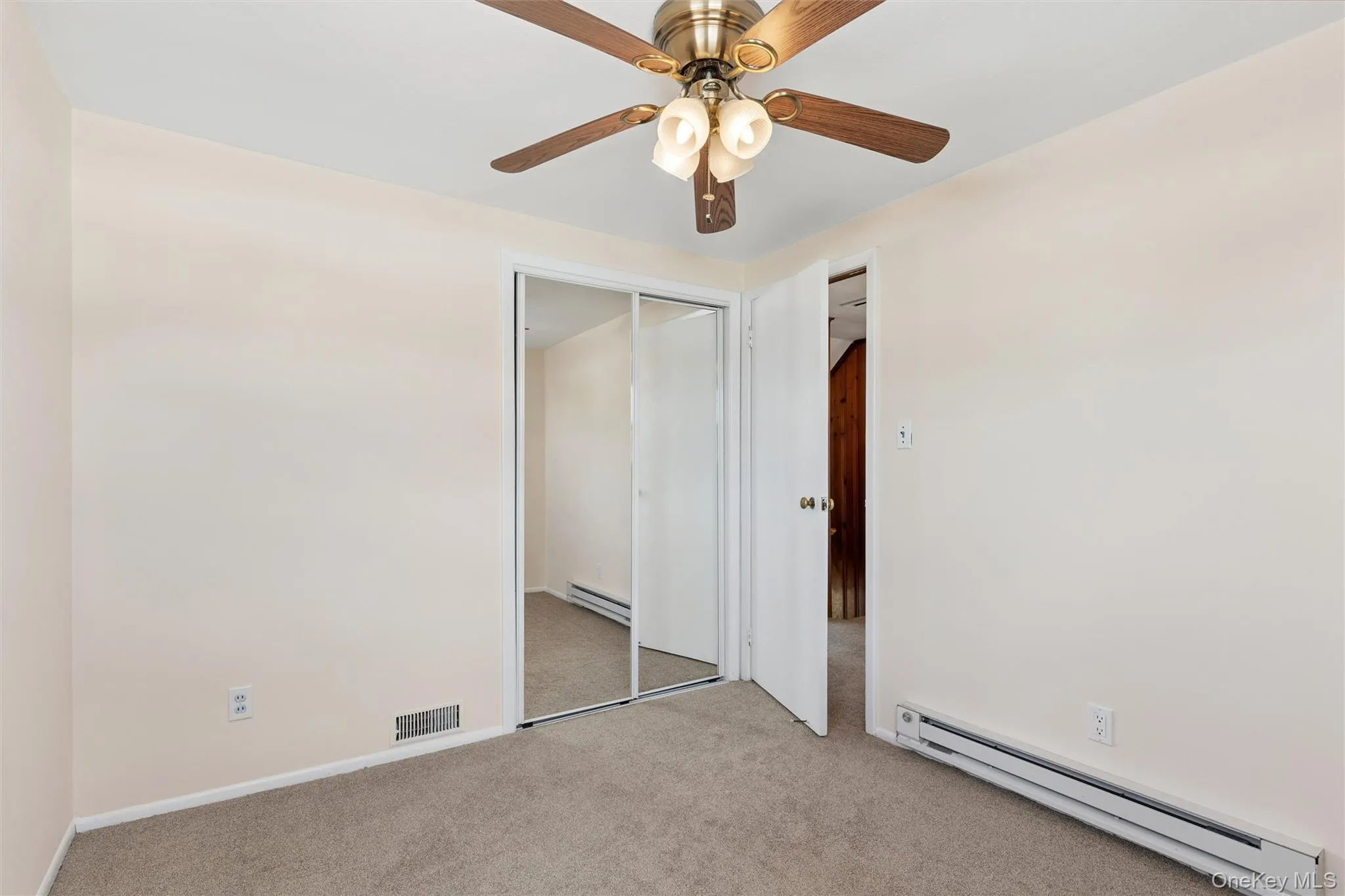 Bedroom with ceiling fan and carpet and plenty of natural light Bedroom with ceiling fan and carpet and plenty of natural light