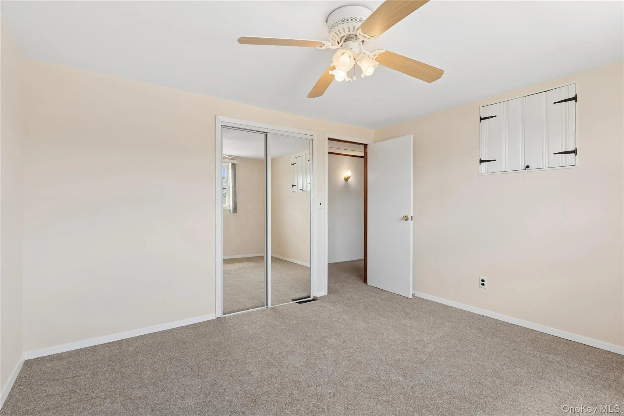 Bedroom with ceiling fan and carpet and plenty of natural light Bedroom with ceiling fan and carpet and plenty of natural light
