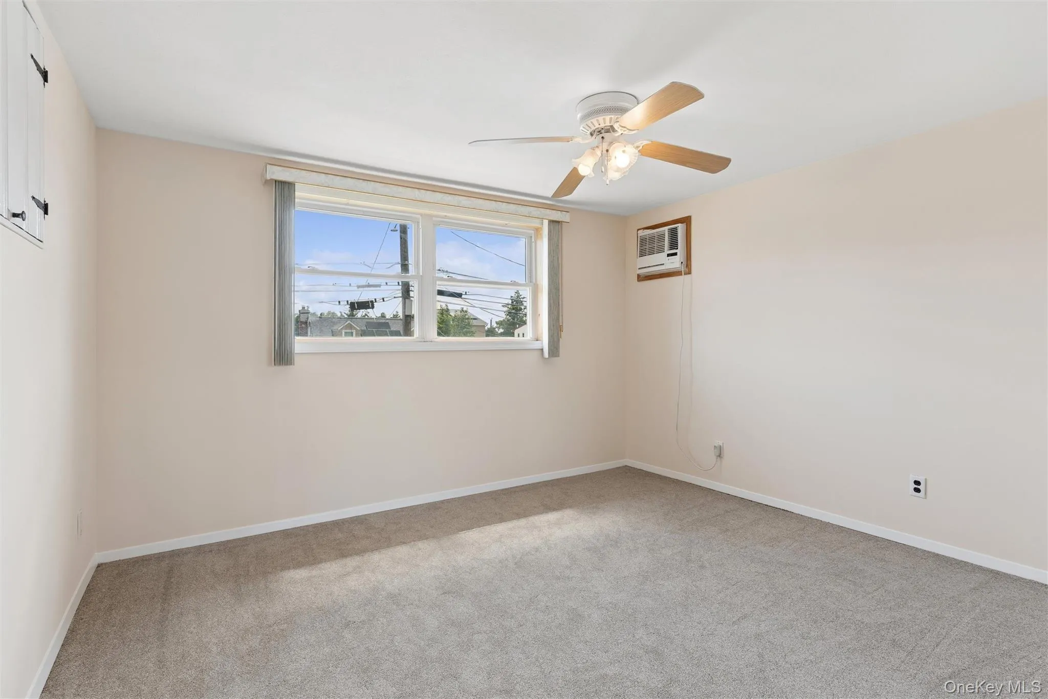 Bedroom with ceiling fan and carpet and plenty of natural light Bedroom with ceiling fan and carpet and plenty of natural light
