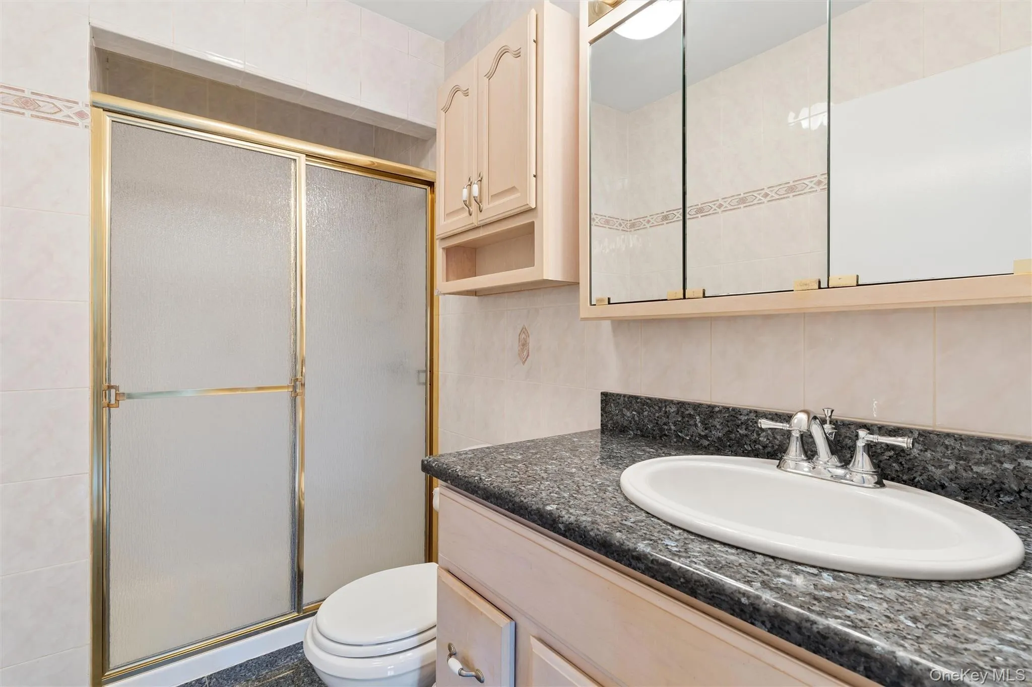 Bathroom with glass shower doors Bathroom with glass shower doors