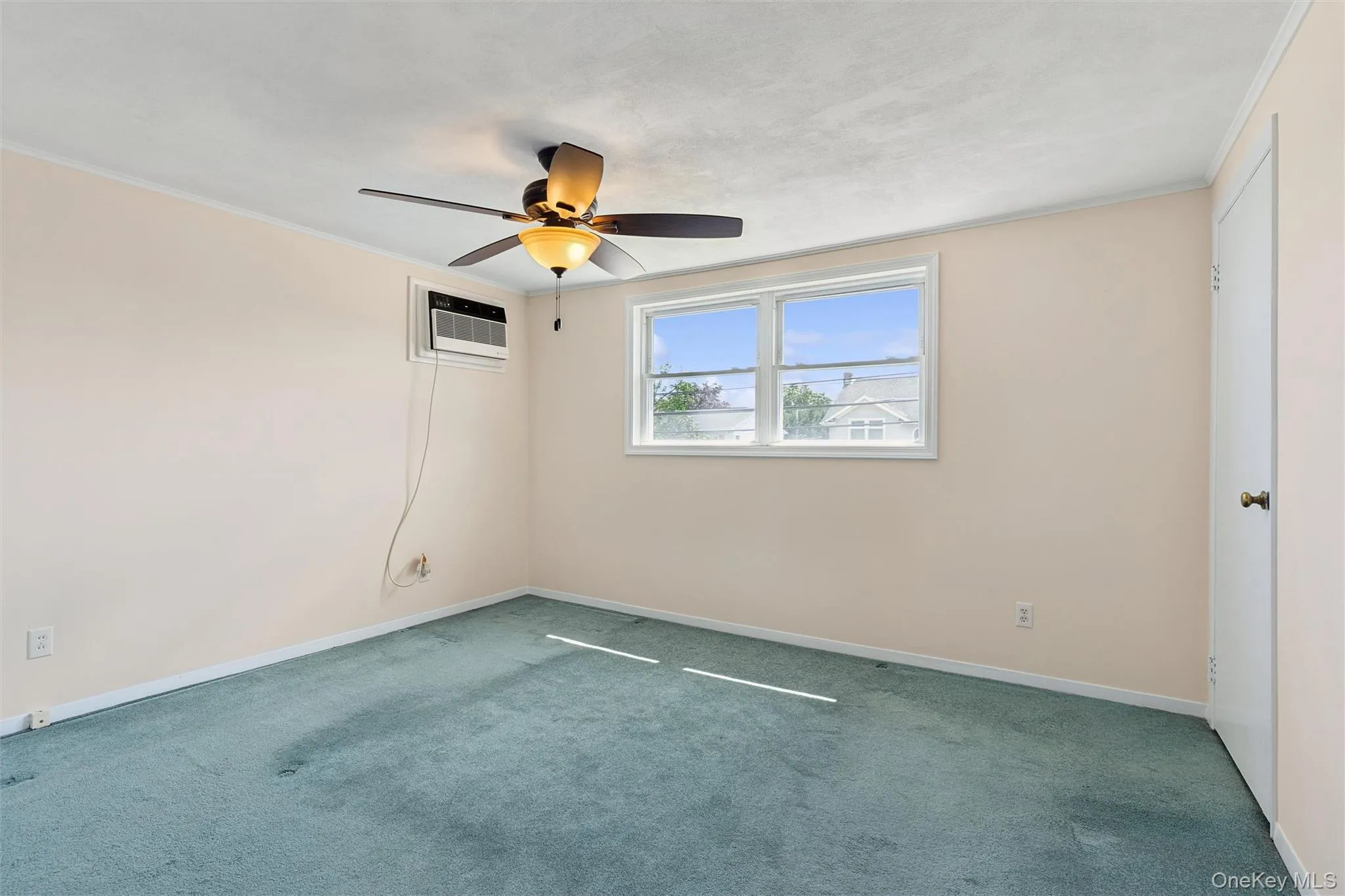 Bedroom with ceiling fan and carpet Bedroom with ceiling fan and carpet