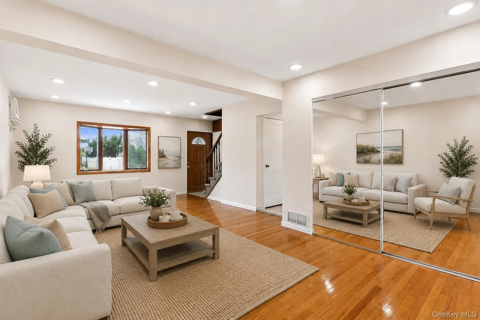 Living room with bay window, recessed lighting and lots of natural lightThis photo was virtually staged Living room with bay window, recessed lighting and lots of natural lightThis photo was virtually staged