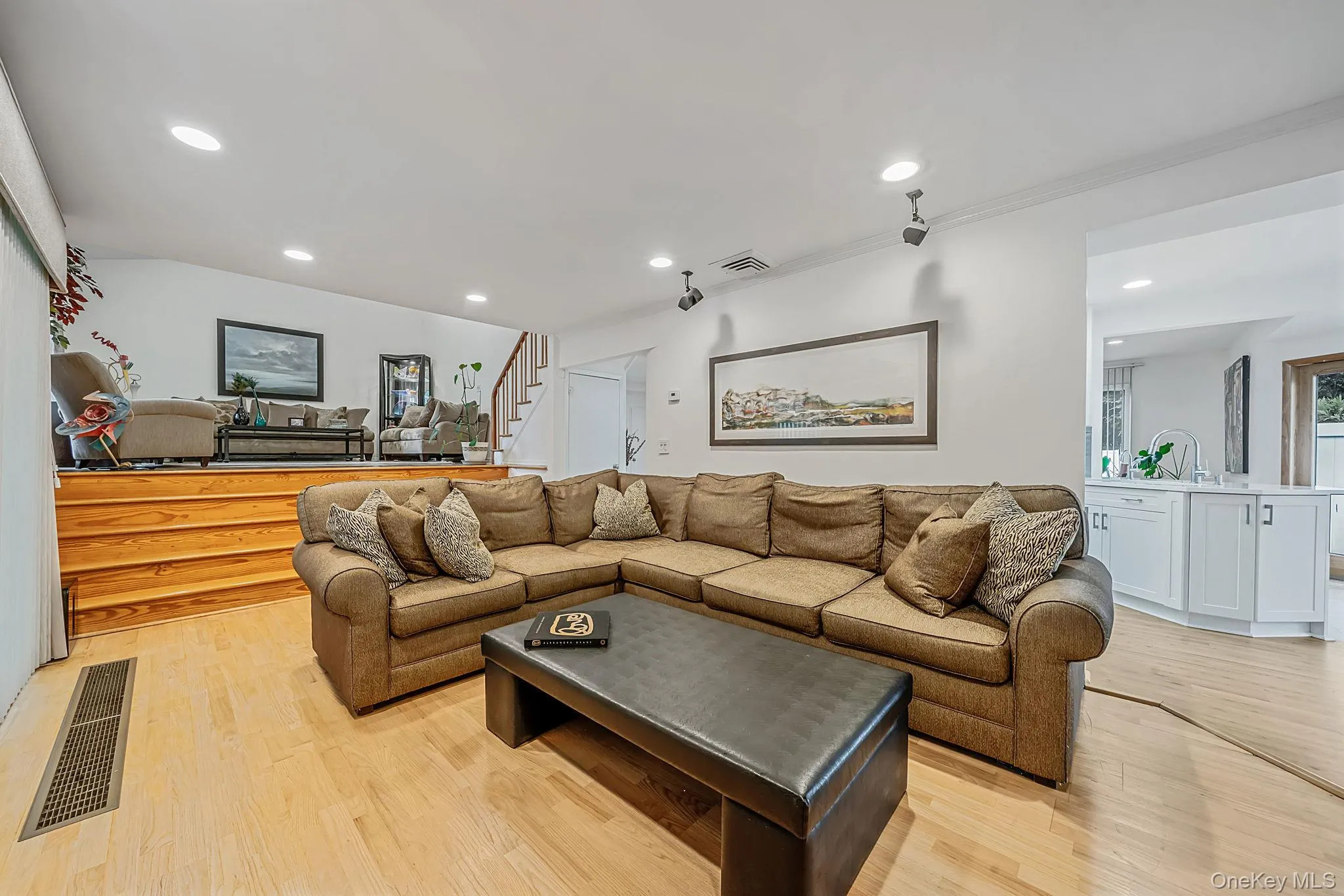 Den with access to elevated living room Den with access to elevated living room