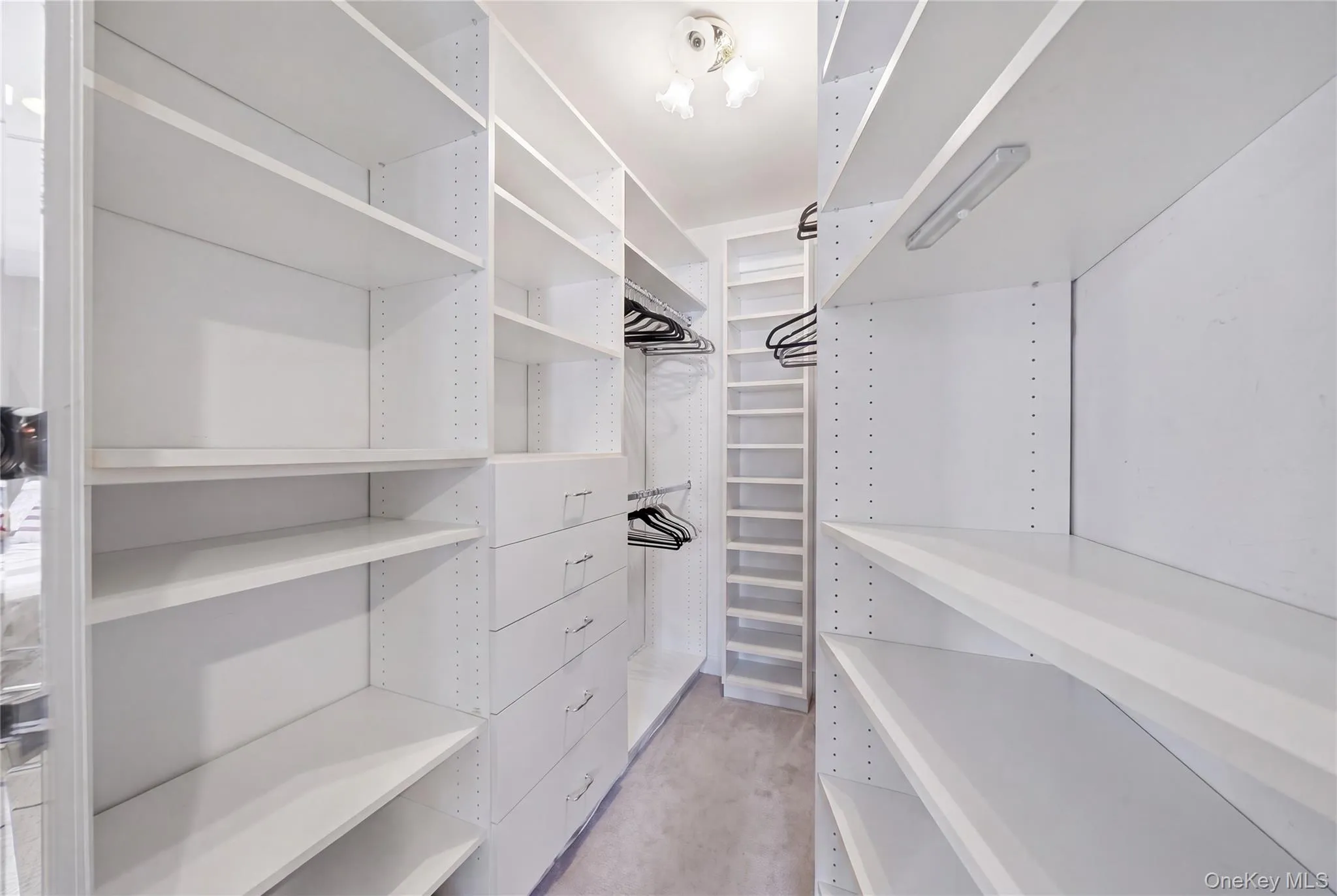 Huge Walk in Closet with Custom Built-ins in Primary Bedroom Huge Walk in Closet with Custom Built-ins in Primary Bedroom