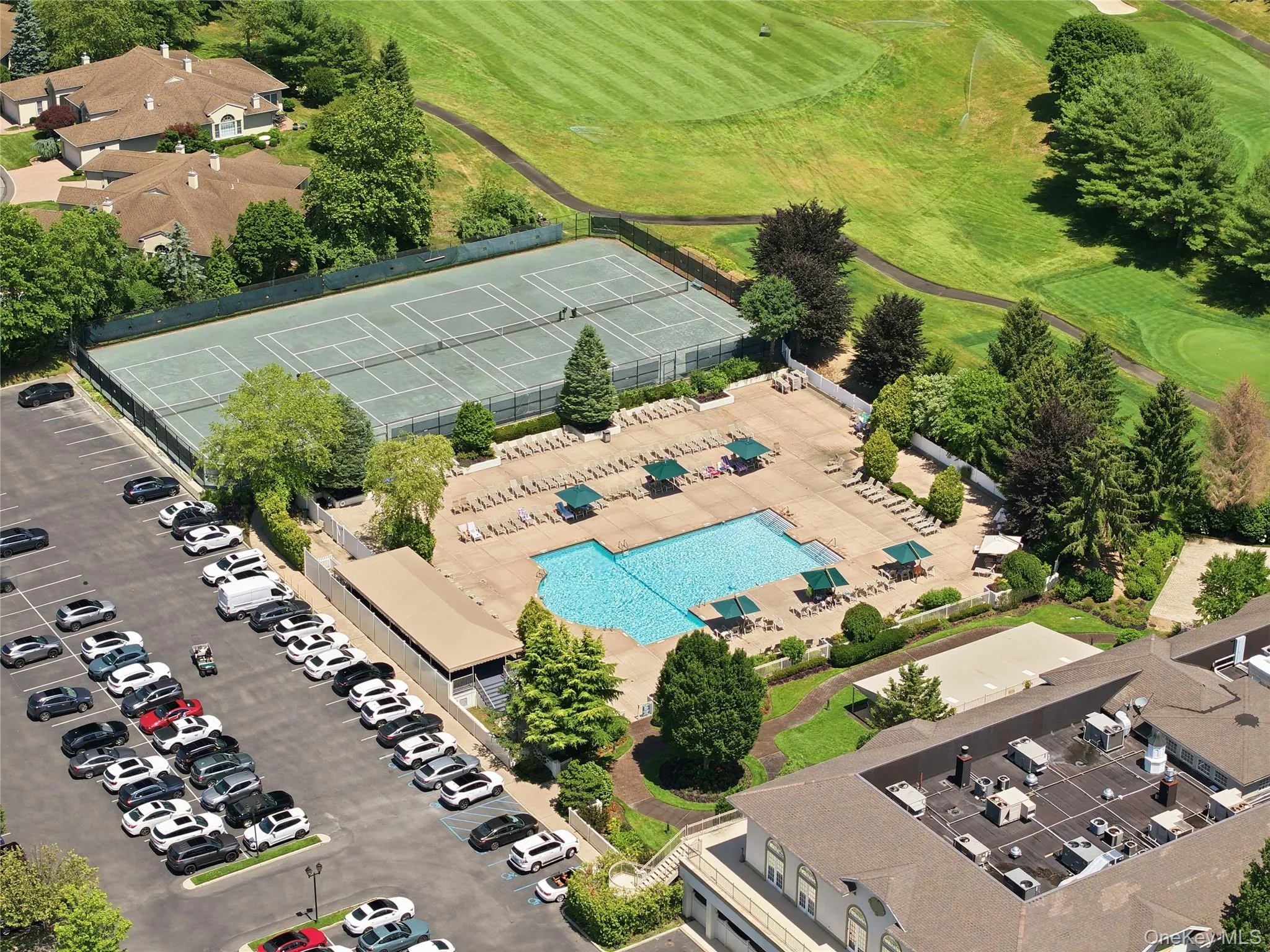 Aerial view of outdoor pool & Tennis Courts Aerial view of outdoor pool & Tennis Courts