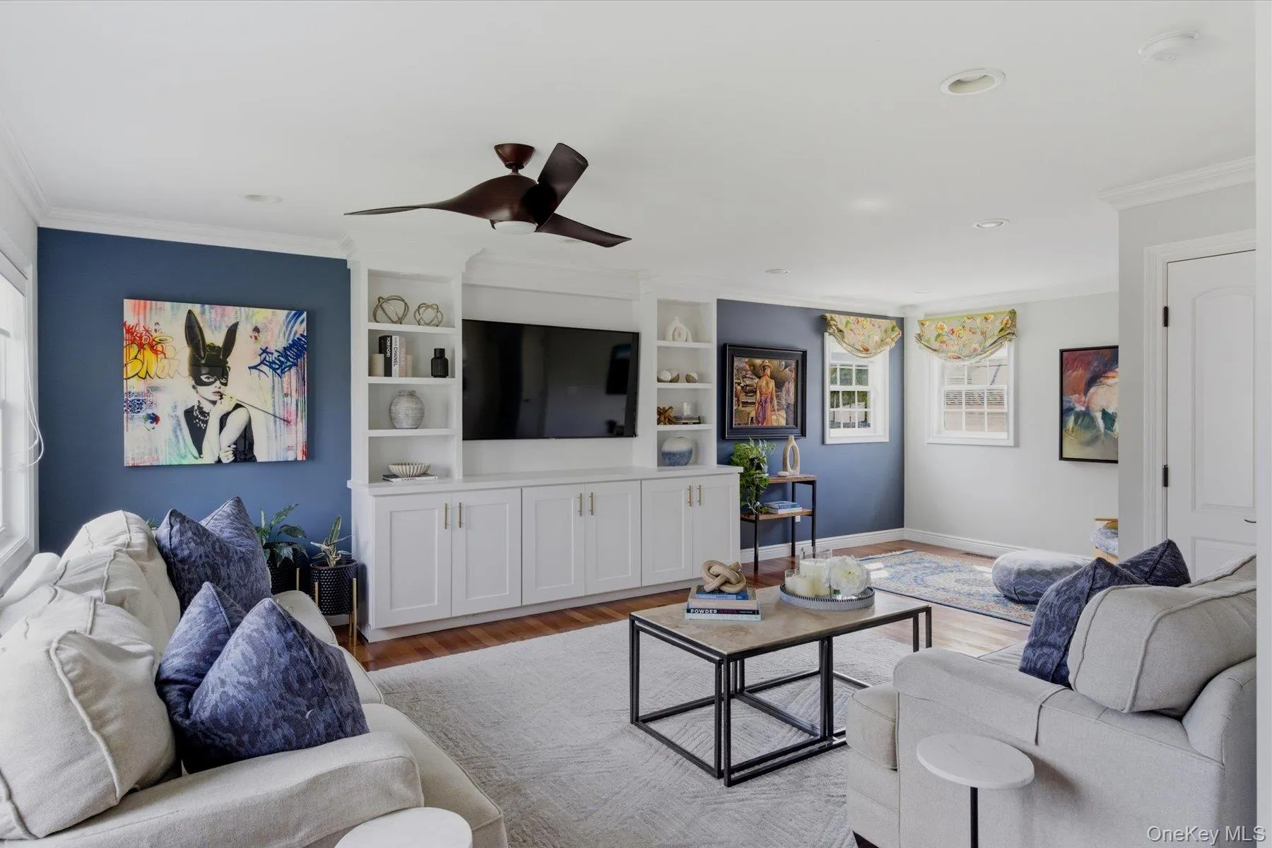 Den with custom built in cabinetry Den with custom built in cabinetry